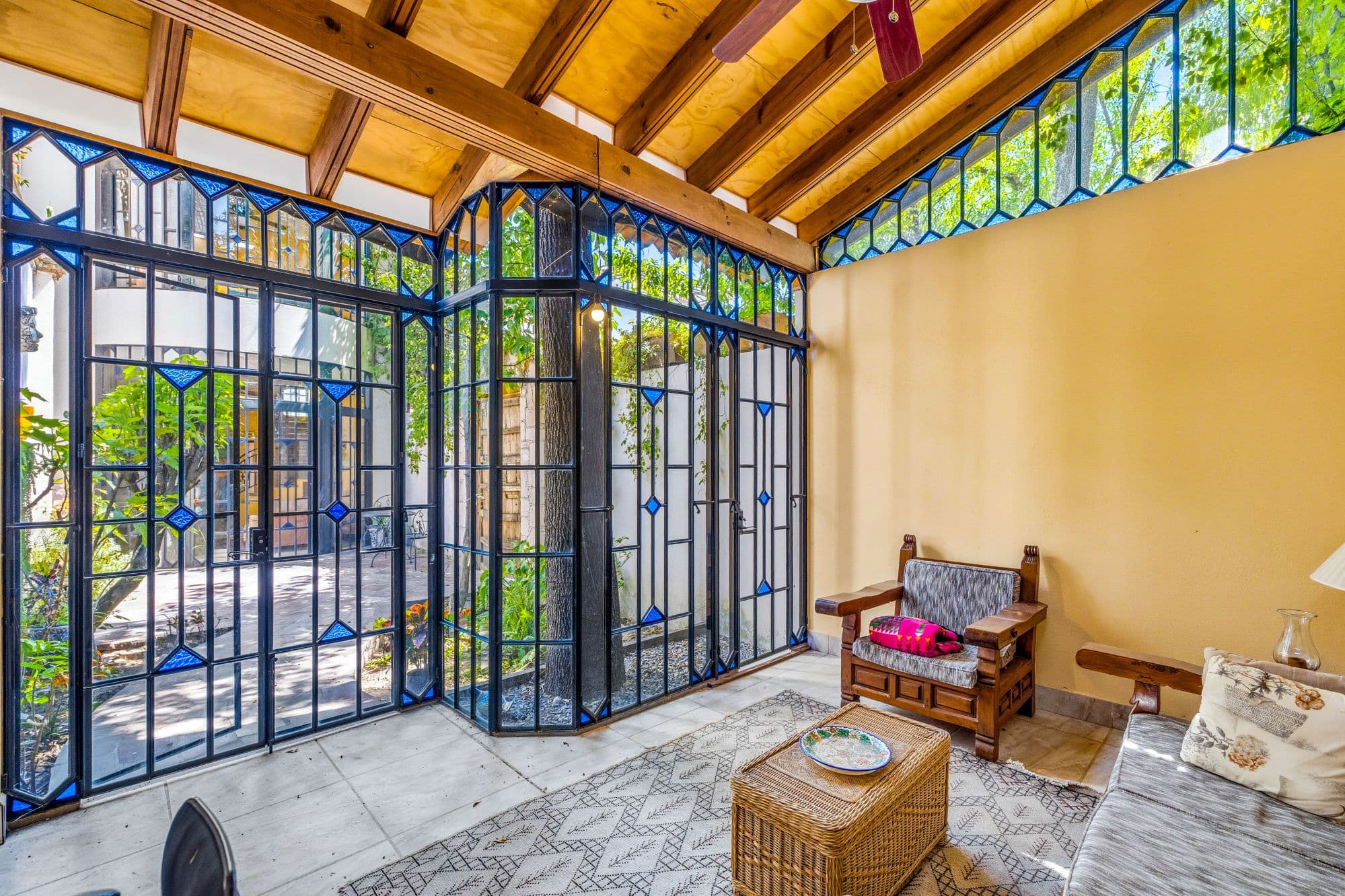 Casa Grande — Guadiana, San Miguel de Allende — photo 24 — sunlit conservatory, architectural glass walls