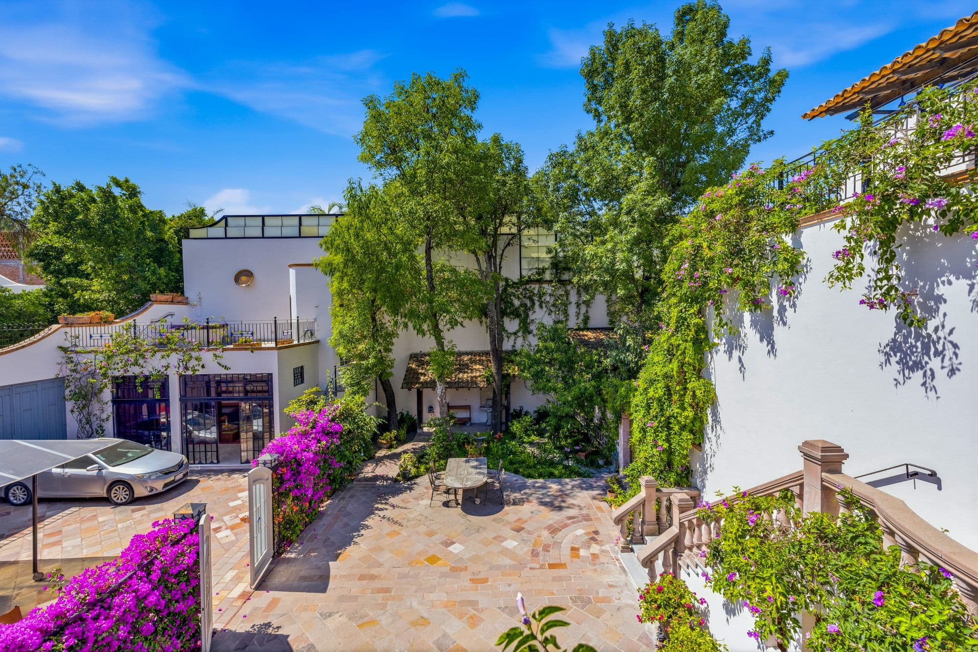 Casa Grande — Guadiana, San Miguel de Allende — photo 26 — serene courtyard oasis, vibrant bougainvillea blooms