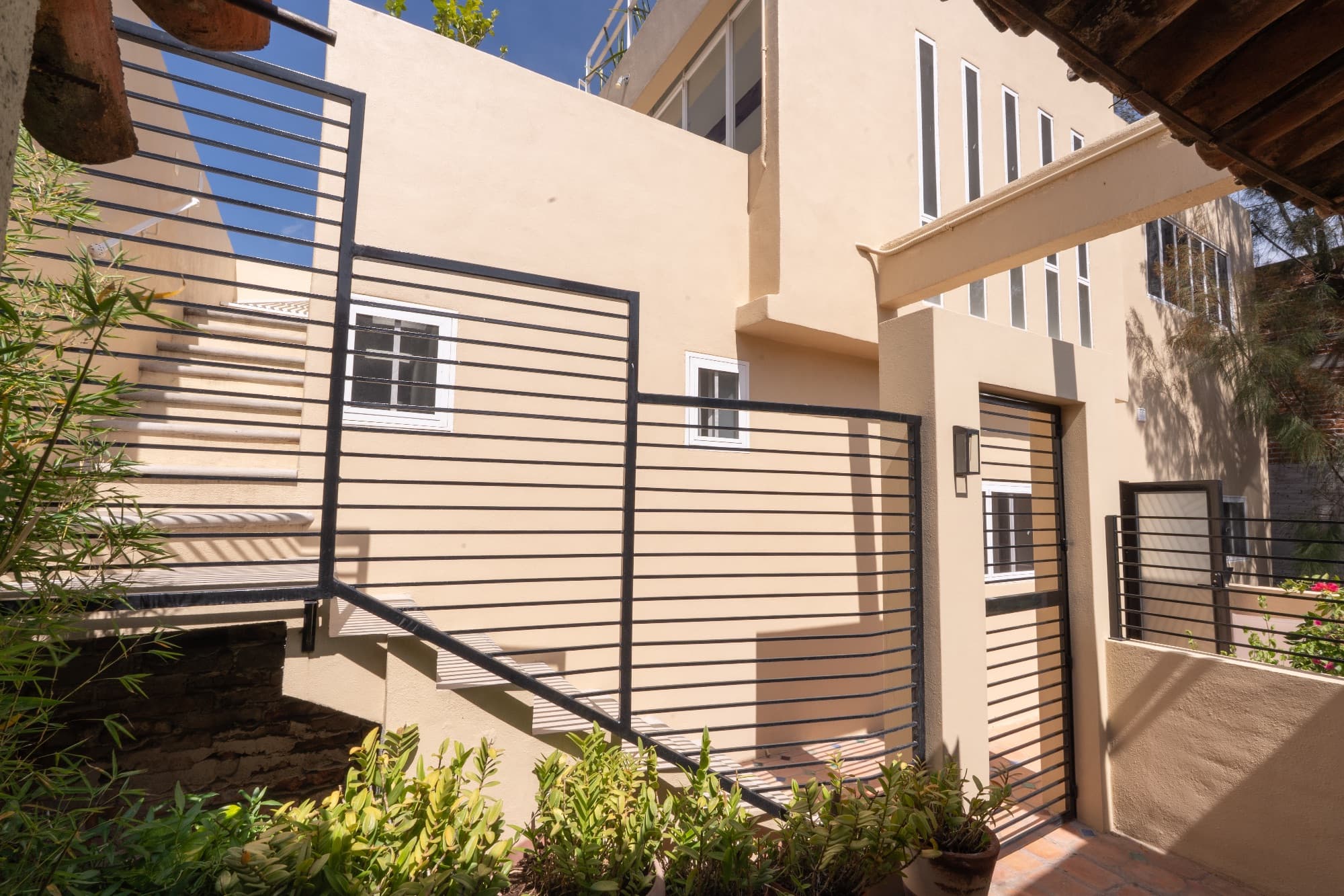 Condo del Sol — Guadalupe, San Miguel de Allende — photo 25 — contemporary courtyard with elegant metal railings