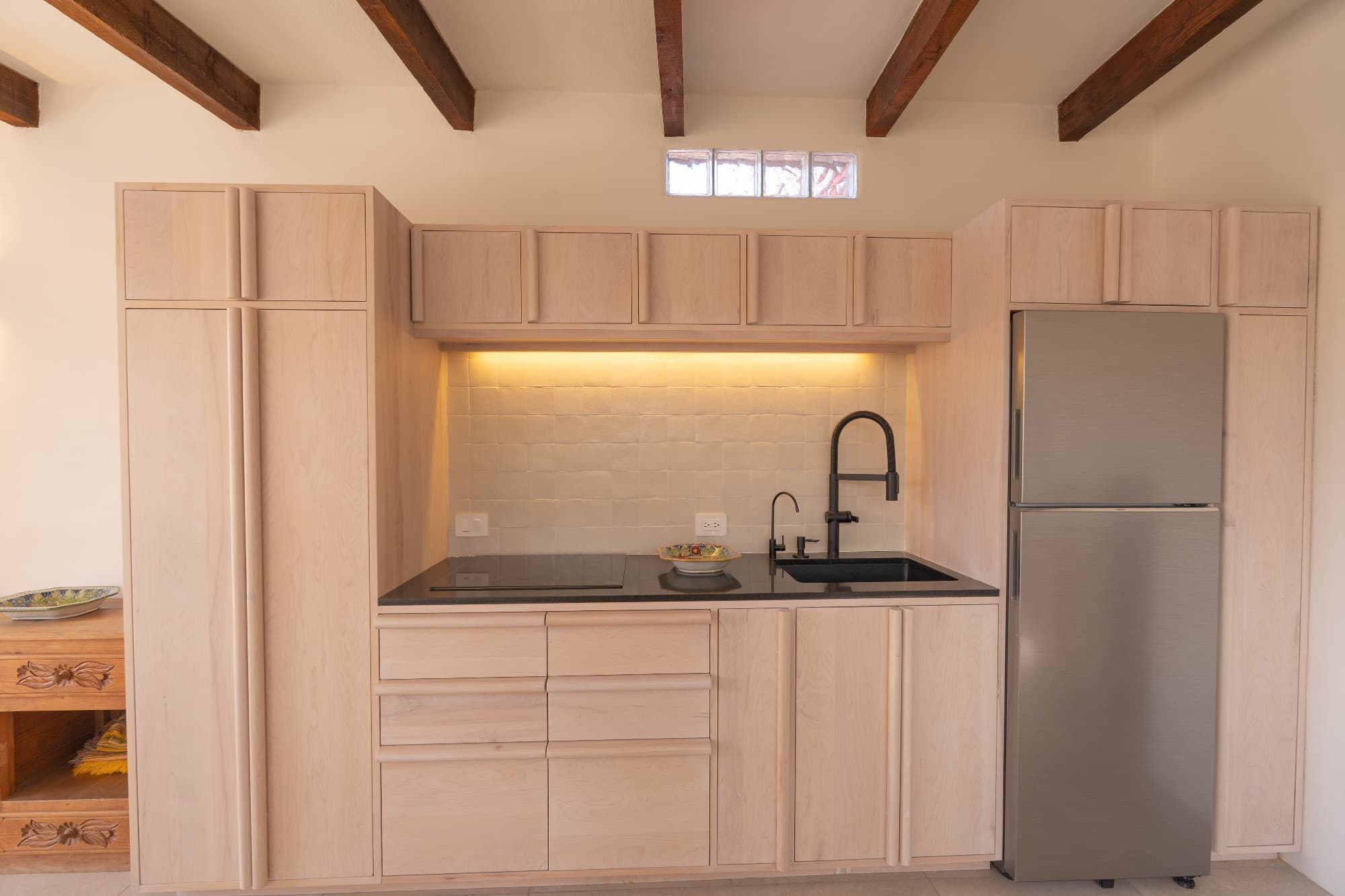 Condo del Sol — Guadalupe, San Miguel de Allende — photo 6 — contemporary kitchen with rustic wooden beams