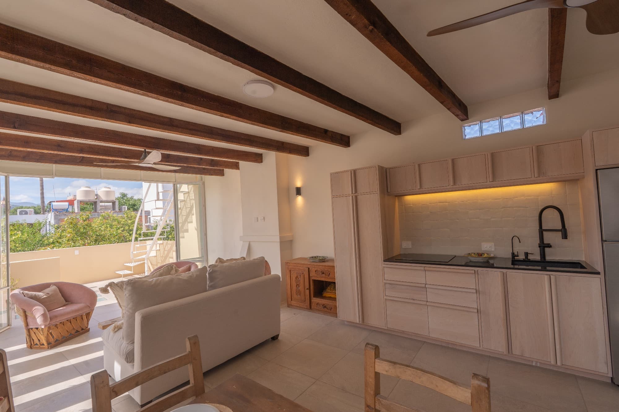 Condo del Sol — Guadalupe, San Miguel de Allende — photo 7 — luminous open-concept living with architectural beams