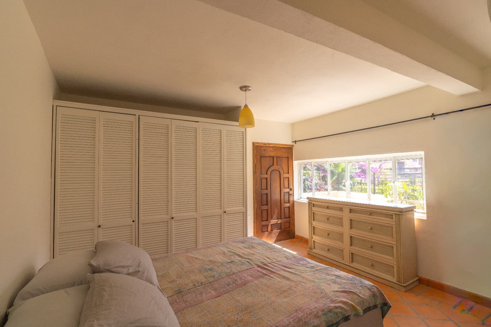 Condo del Sol — Guadalupe, San Miguel de Allende — photo 17 — luminous master suite, architectural charm, garden views