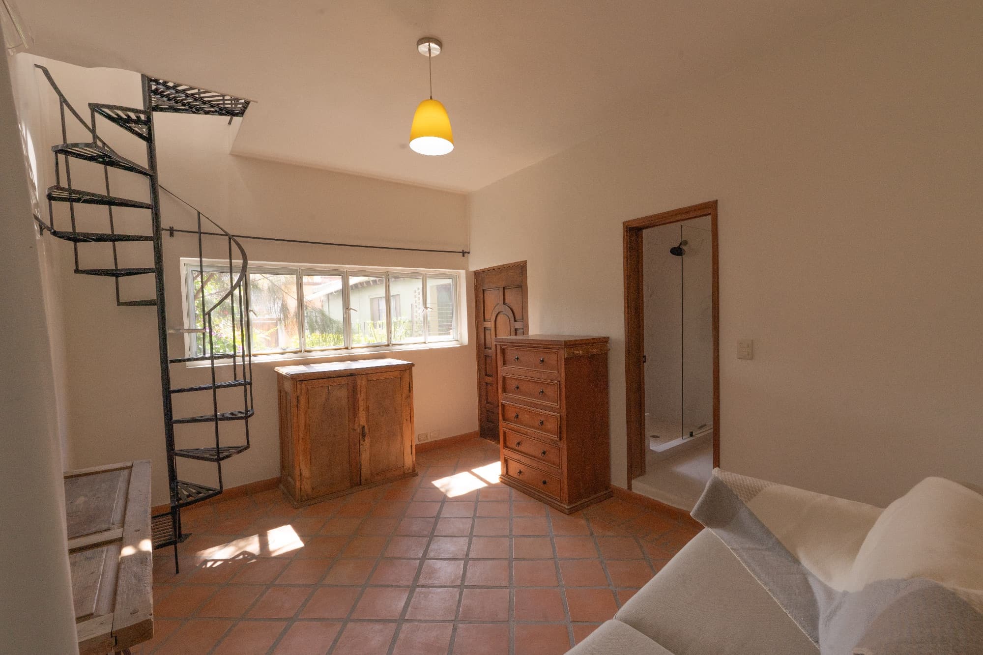 Condo del Sol — Guadalupe, San Miguel de Allende — photo 18 — sun-flooded bedroom with rustic charm