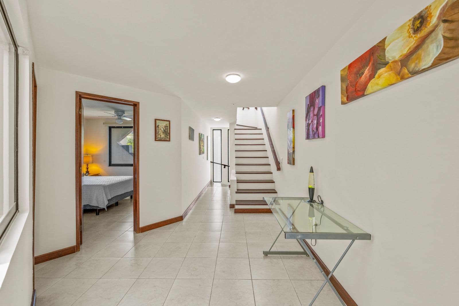 Casa Gorrion — Las Brisas, San Miguel de Allende — photo 2 — bright hallway, elegant wooden staircase