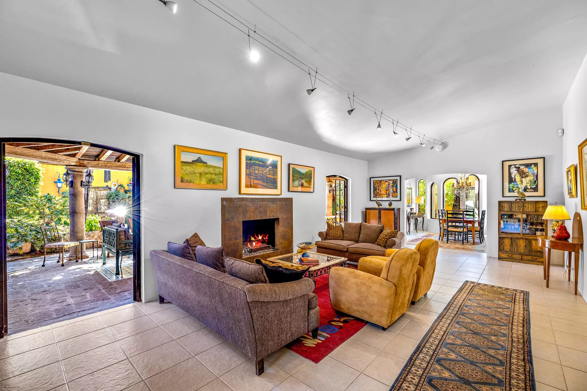 Casa Nispero — Atascadero (Arcos de San Miguel), San Miguel de Allende — photo 6 — sophisticated living with glowing fireplace elegance