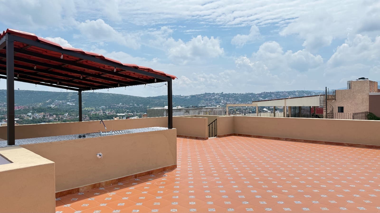 Duplex Juan Escutia 142 — Independencia, San Miguel de Allende — photo 22 — panoramic hilltop terrace with mountain vistas