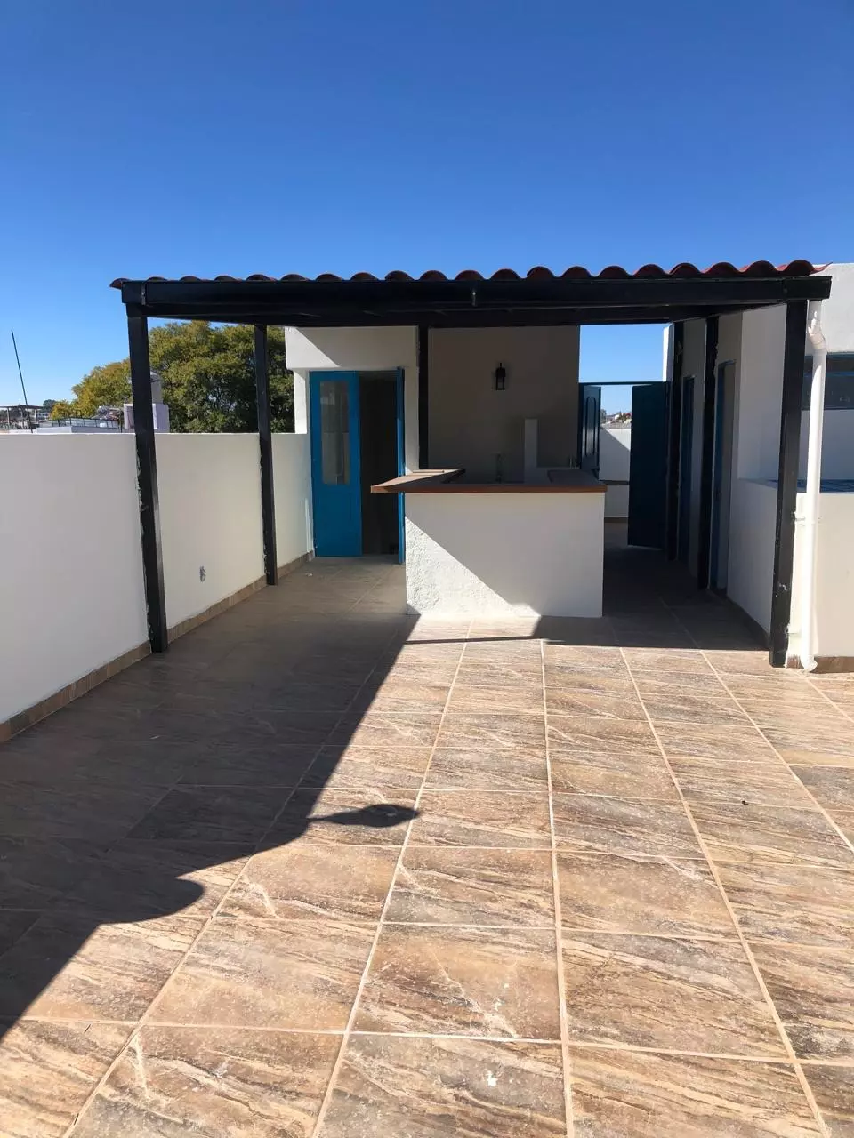 Casa Organica — Guadalupe, San Miguel de Allende — photo 11 — sunlit terrace with architectural charm