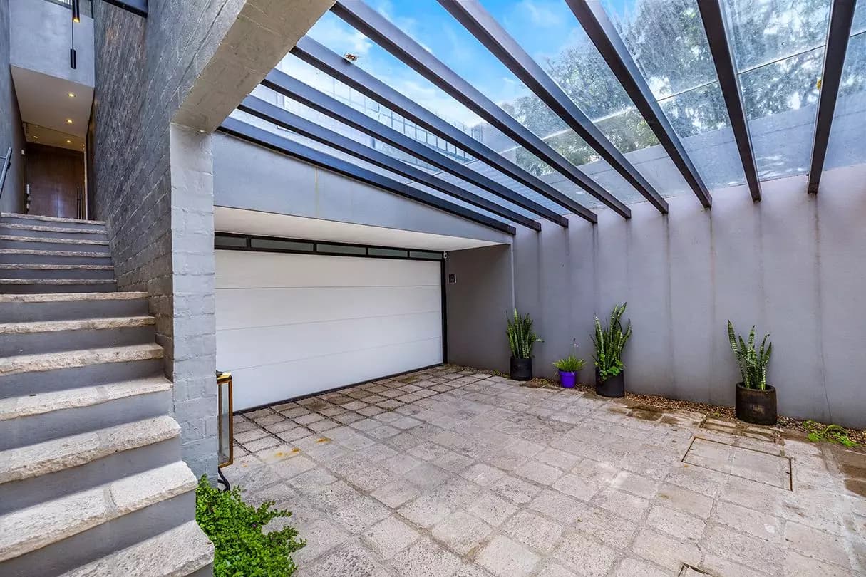 Casa Dos Gatos — Rinconada de Los Balcones, San Miguel de Allende — photo 22 — luminous courtyard, architectural glass ceiling