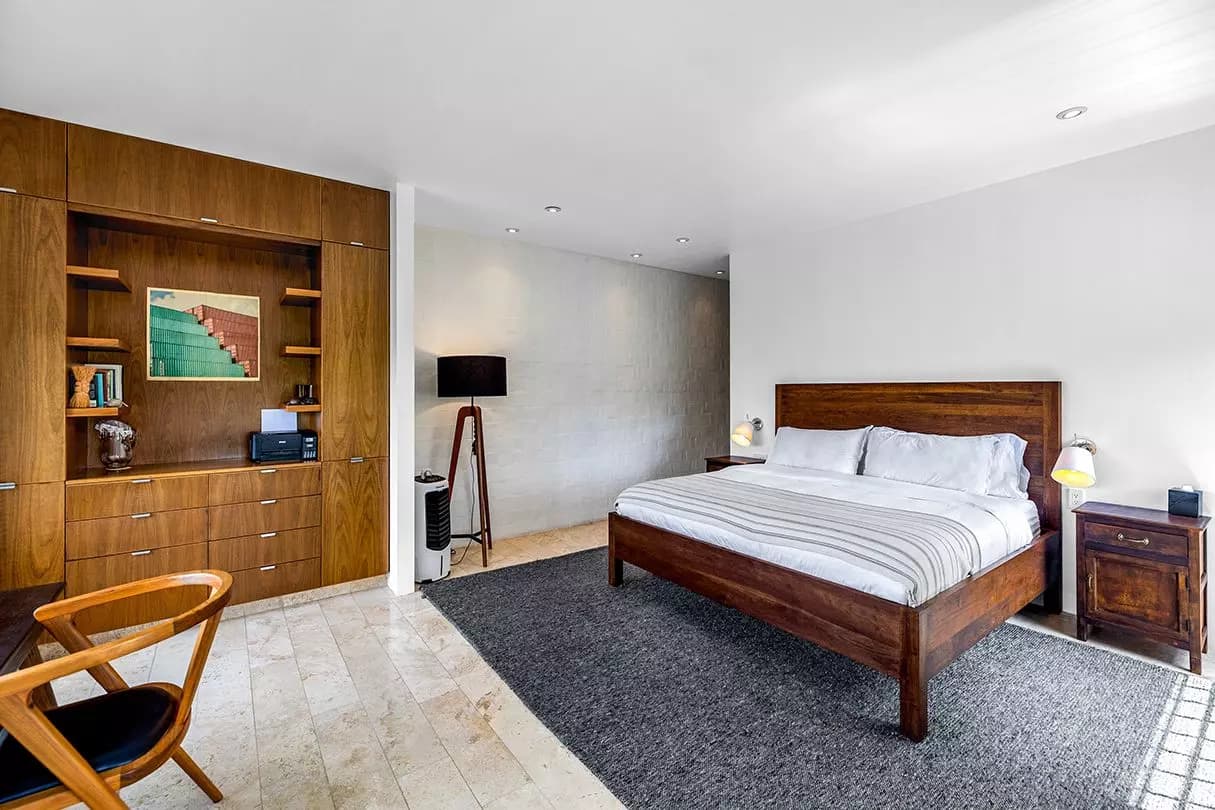 Casa Dos Gatos — Rinconada de Los Balcones, San Miguel de Allende — photo 12 — sophisticated master suite, warm wood elegance