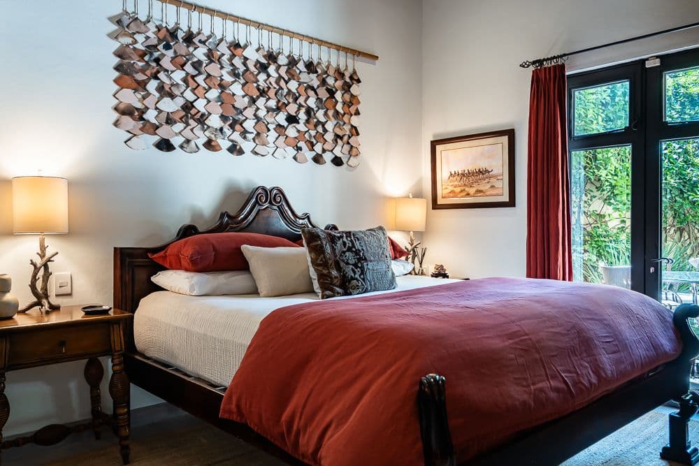 Casa Bella — Guadiana, San Miguel de Allende — photo 17 — elegant master suite with artistic accents