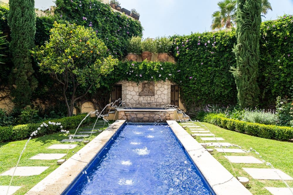 Casa Bella — Guadiana, San Miguel de Allende — photo 15 — serene lap pool, verdant mediterranean garden