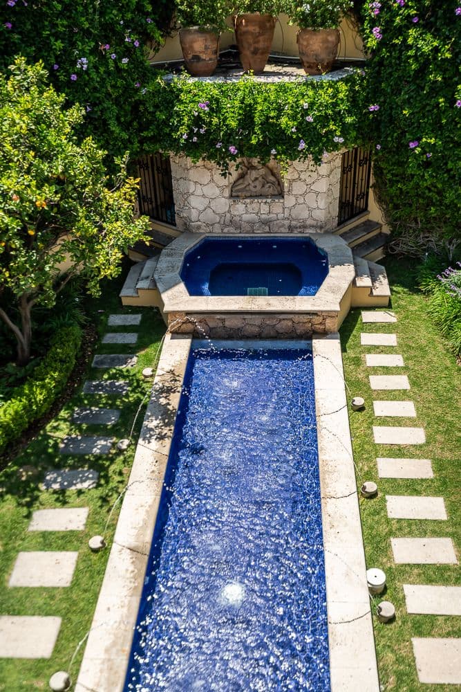 Casa Bella — Guadiana, San Miguel de Allende — photo 24 — serene courtyard oasis, lush gardens, resort-style pool