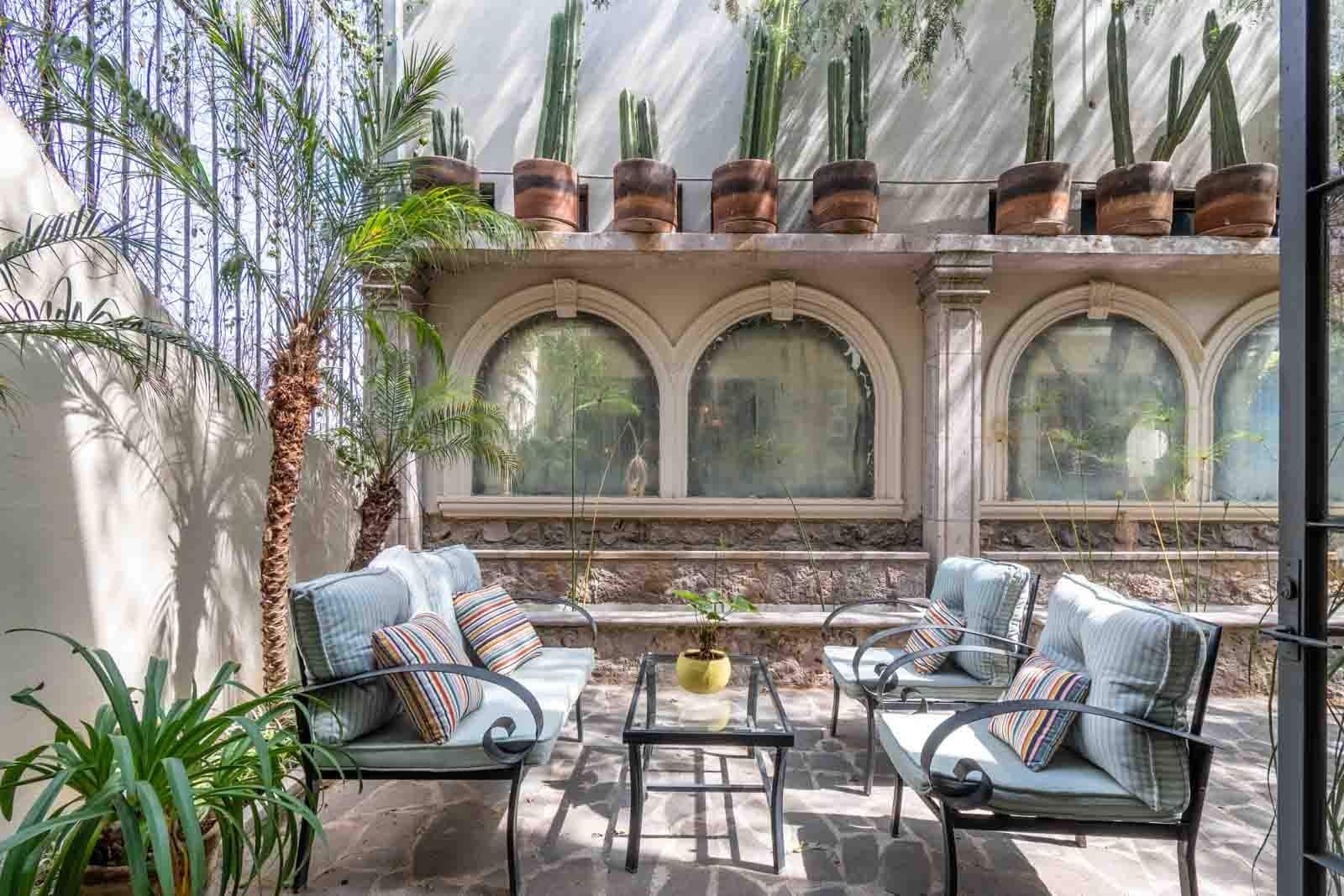 The Hidden Enclave — Centro, San Miguel de Allende — photo 6 — sunlit courtyard, architectural elegance, lush botanicals
