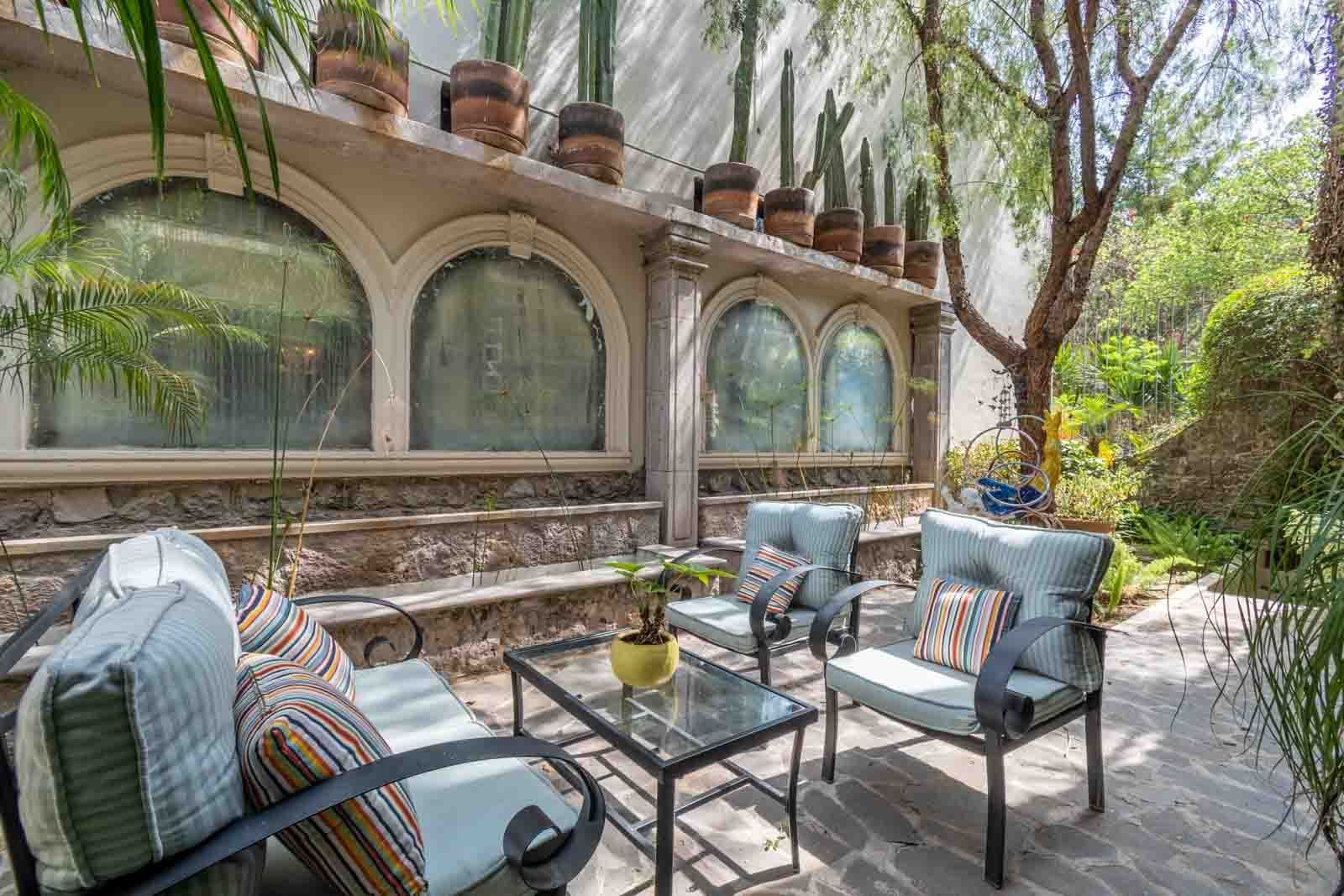 The Hidden Enclave — Centro, San Miguel de Allende — photo 5 — serene courtyard, dappled sunlight, architectural charm