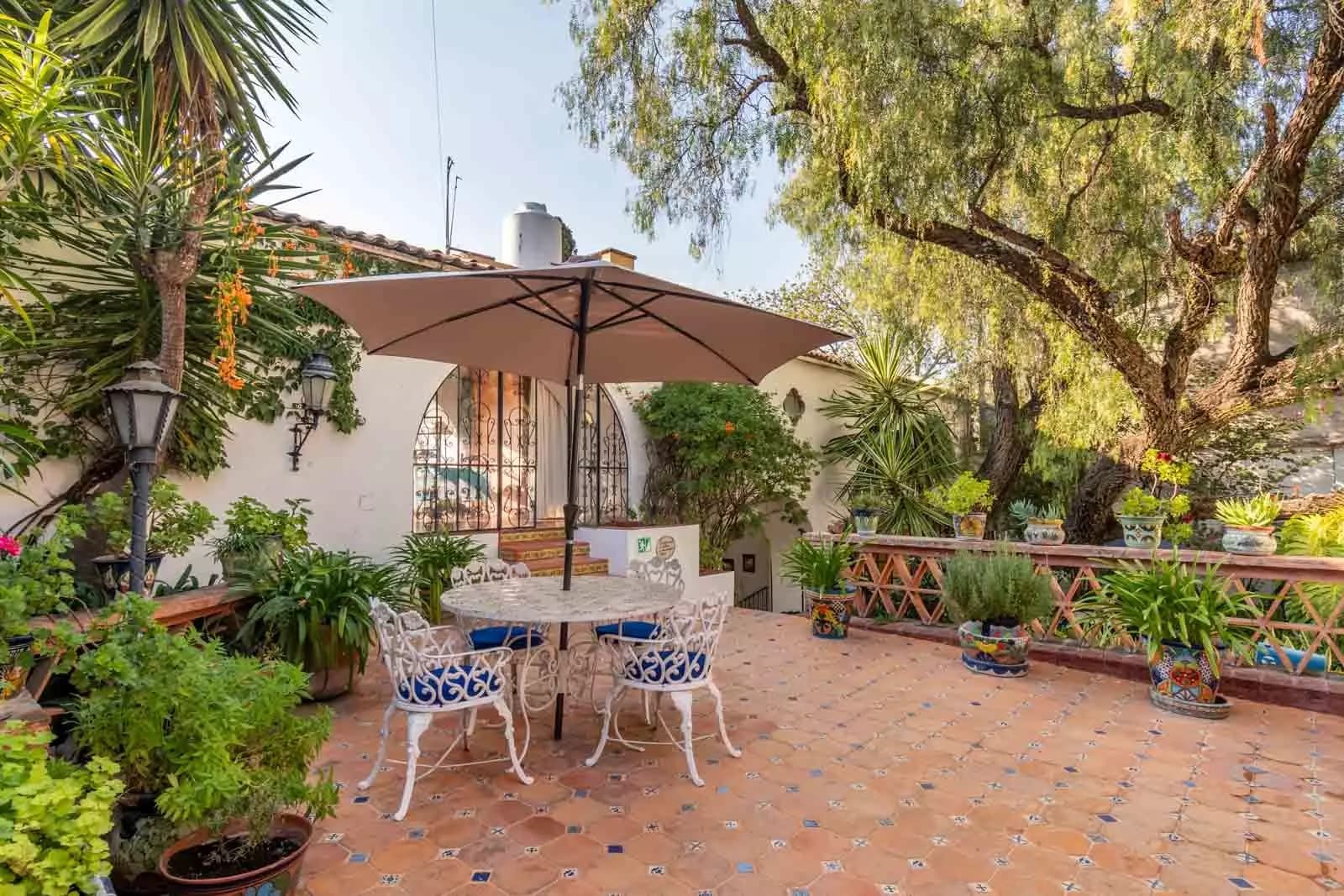 Villa Mariposa — Atascadero (Arcos de San Miguel), San Miguel de Allende — photo 2 — enchanting courtyard oasis, dappled shade