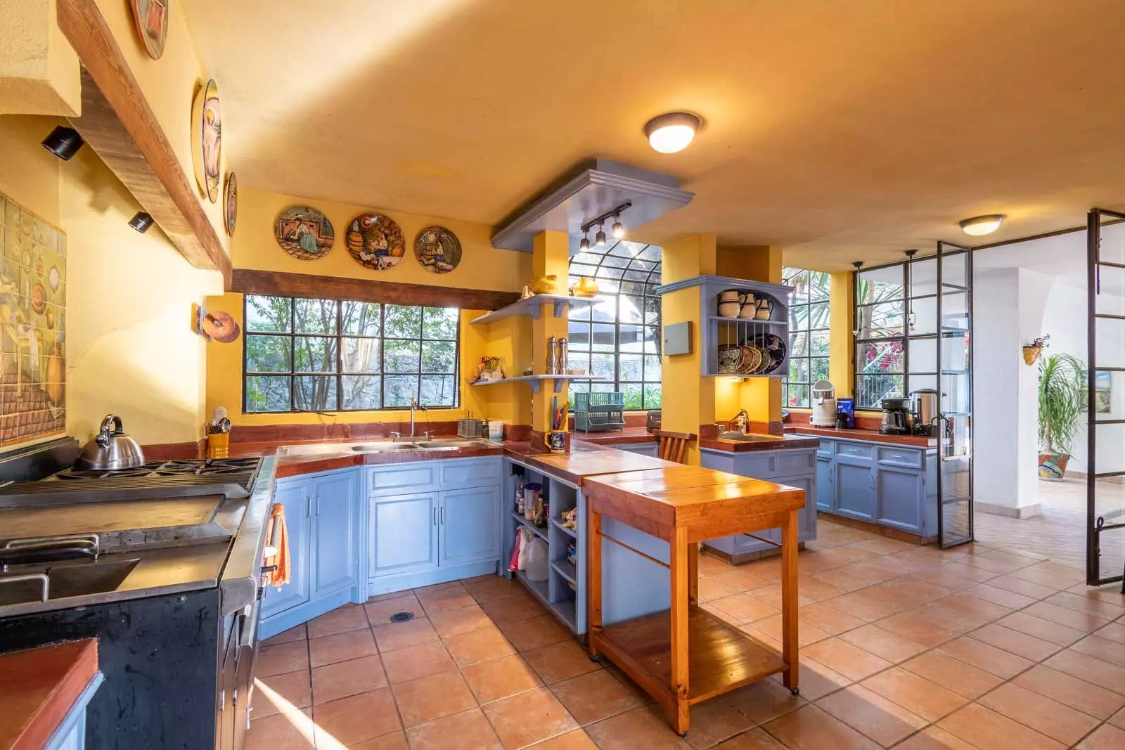 Villa Mariposa — Atascadero (Arcos de San Miguel), San Miguel de Allende — photo 10 — sunlit gourmet kitchen, vibrant traditional charm