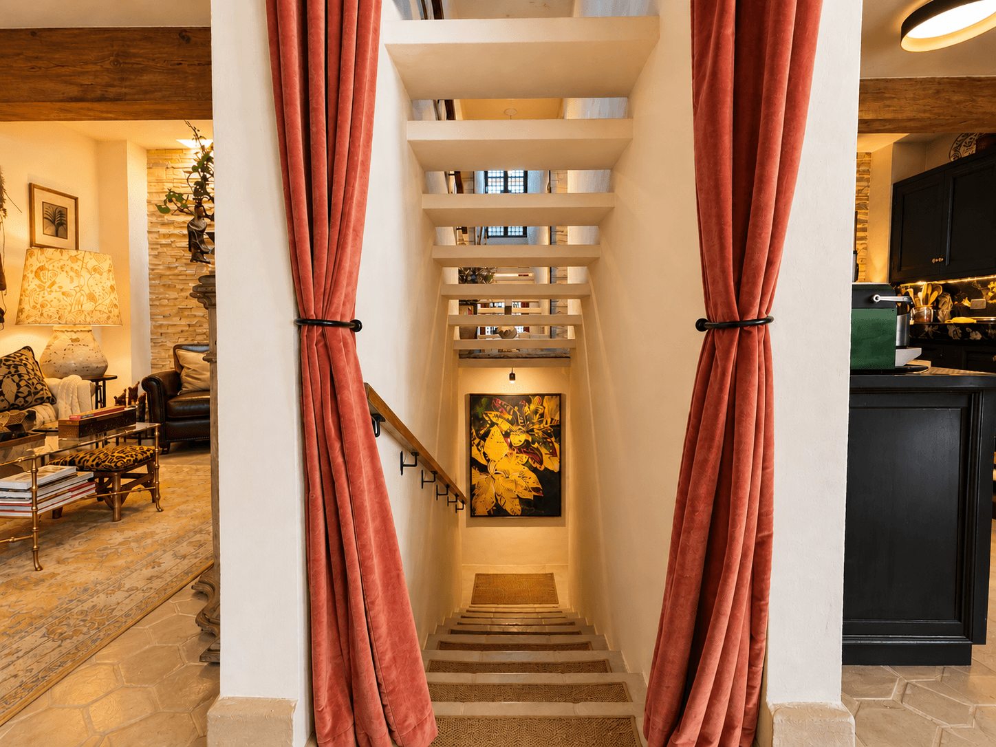 Casa Luna Blanca — San Antonio, San Miguel de Allende — photo 13 — elegant staircase, curated shelving, warm ambiance