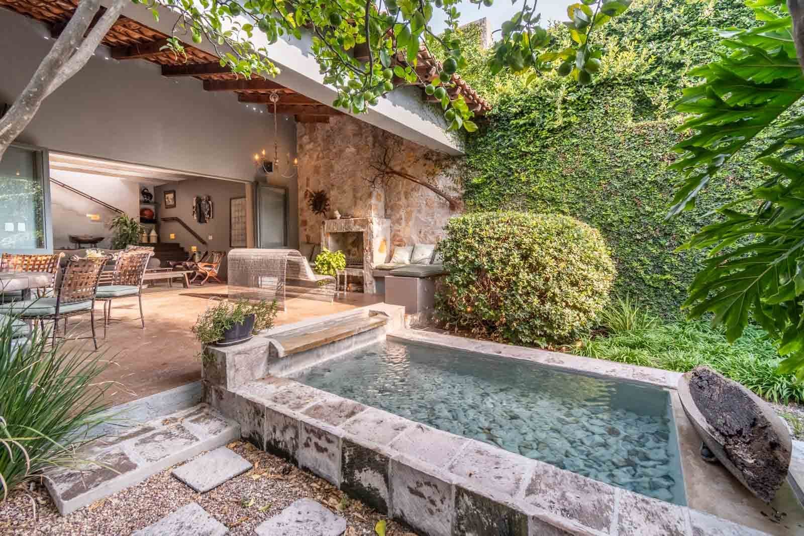 Villa Pirúl — Centro, San Miguel de Allende — photo 10 — sunlit courtyard with serene soaking pool
