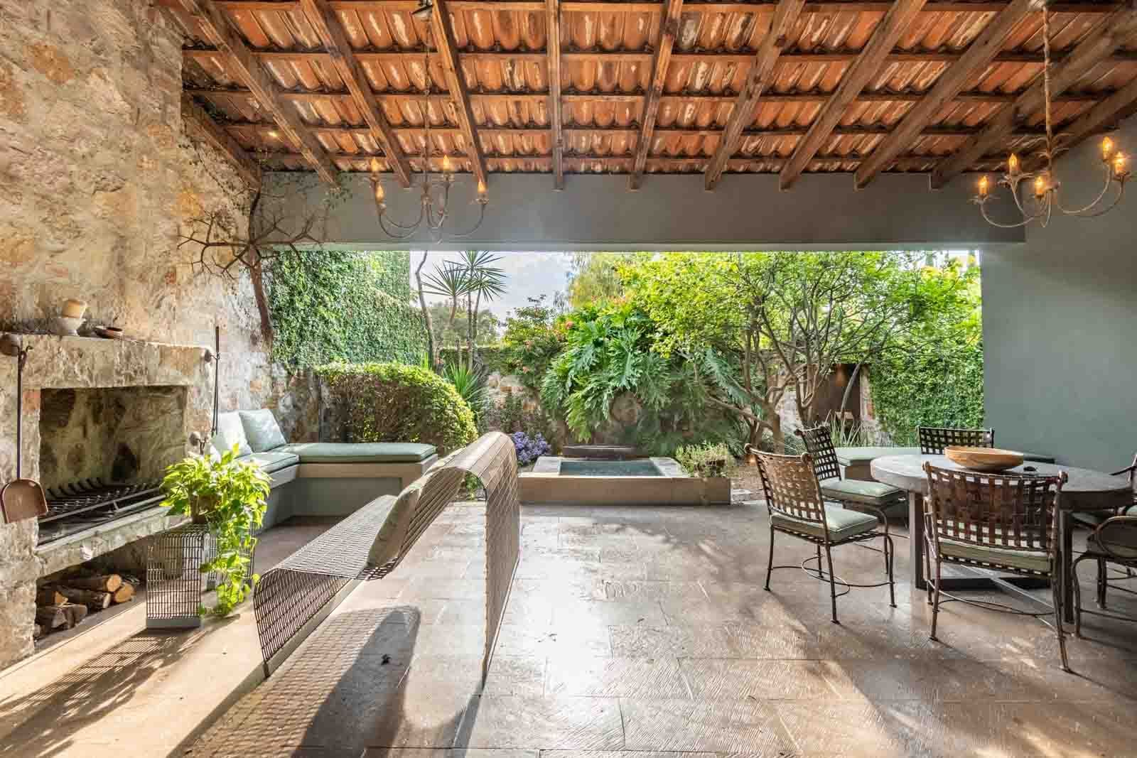 Villa Pirúl — Centro, San Miguel de Allende — photo 9 — sophisticated covered terrace, lush gardens, fireplace