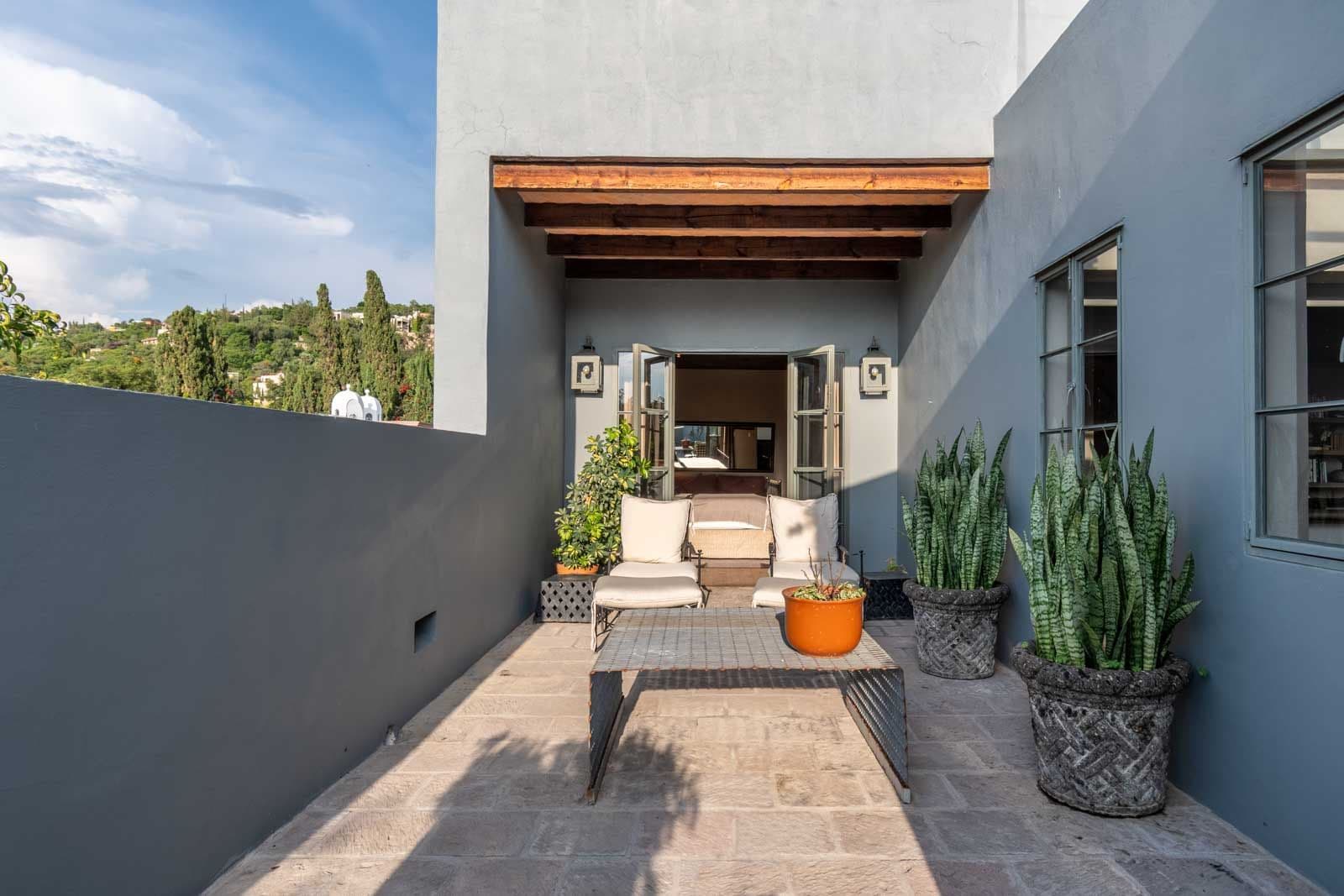 Villa Pirúl — Centro, San Miguel de Allende — photo 20 — serene courtyard with rustic wooden beams