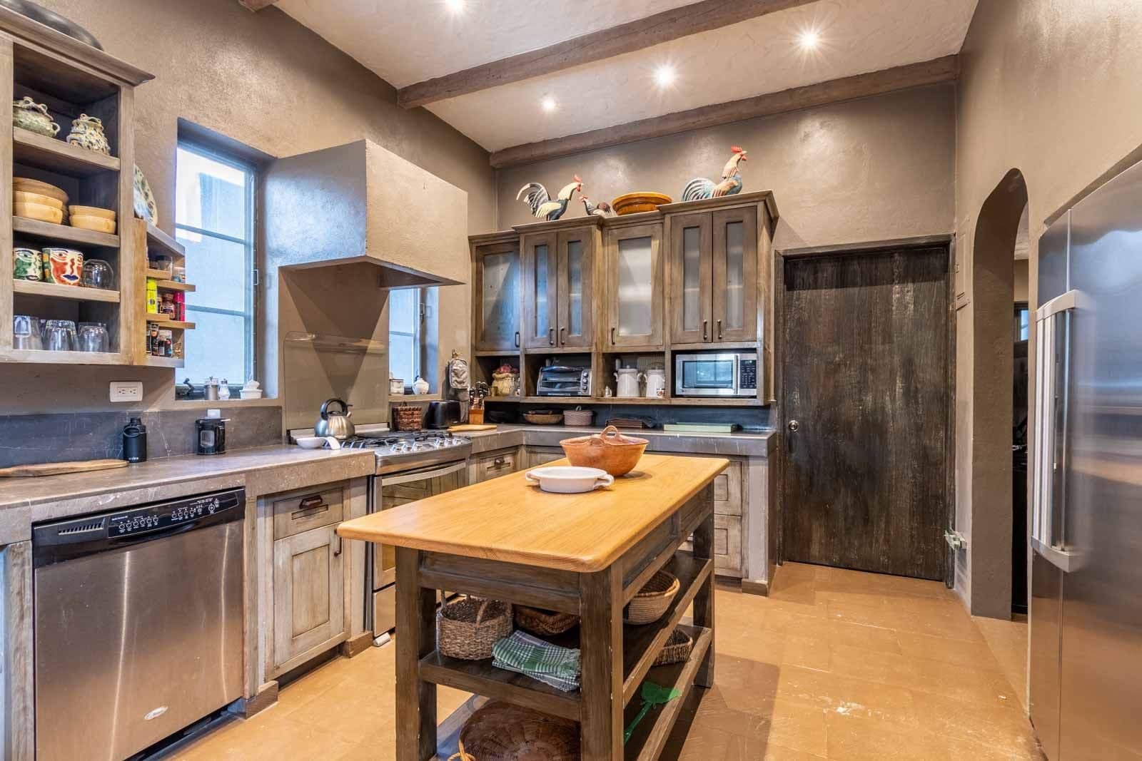 Villa Pirúl — Centro, San Miguel de Allende — photo 14 — rustic-elegant kitchen with soaring beams