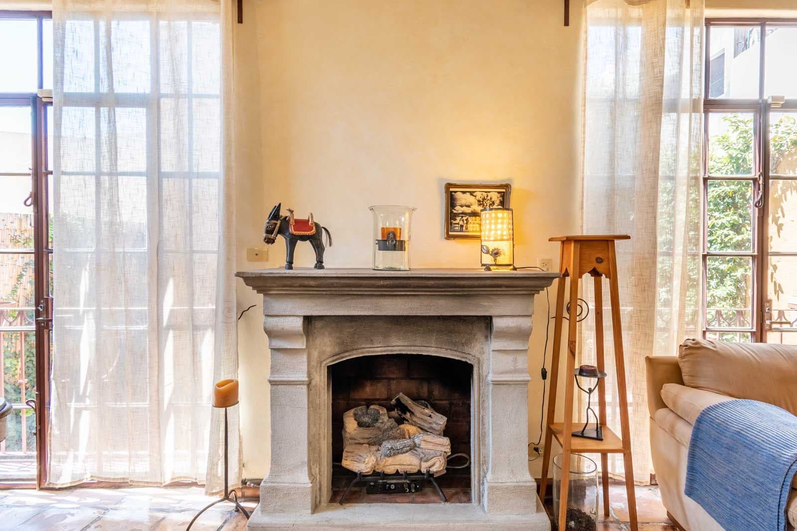 Casa las Nubes — San Antonio, San Miguel de Allende — photo 3 — luminous fireplace with authentic charm details