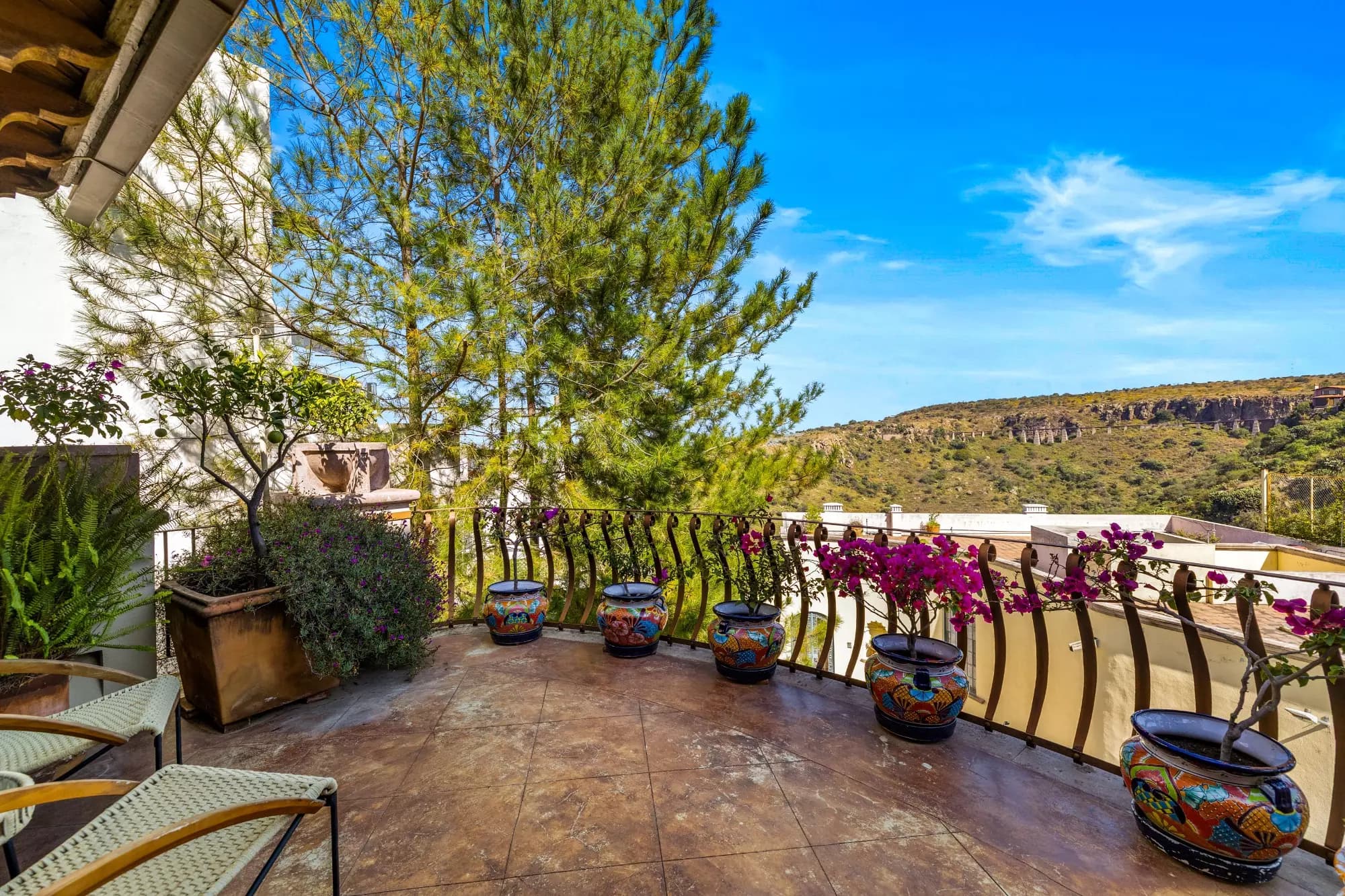 Casa Stone — Balcones, San Miguel de Allende — photo 11 — panoramic hillside terrace, bougainvillea romance