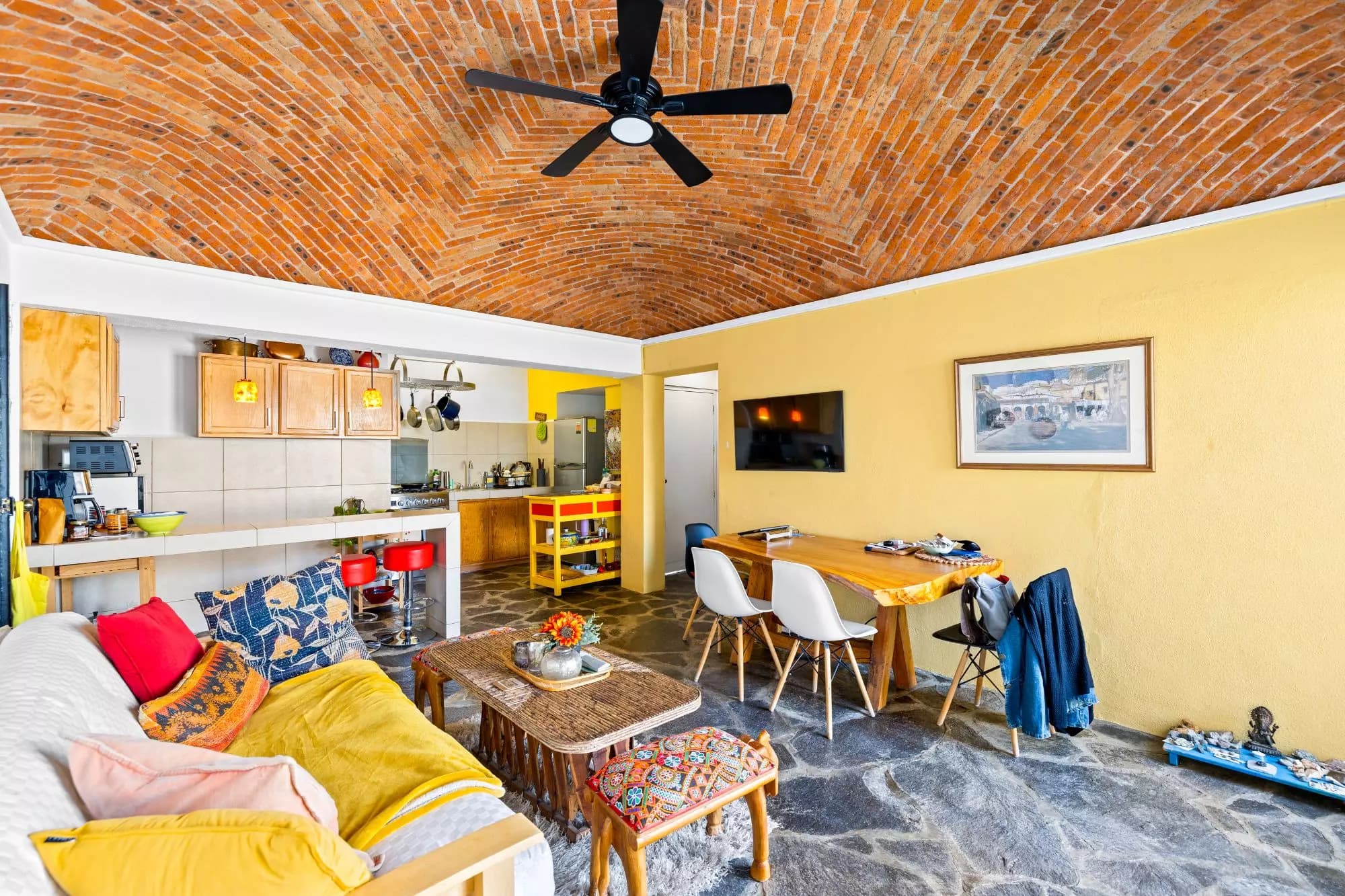Casa del Foro — Balcones, San Miguel de Allende — photo 6 — vibrant open-concept living with soaring brick vaults
