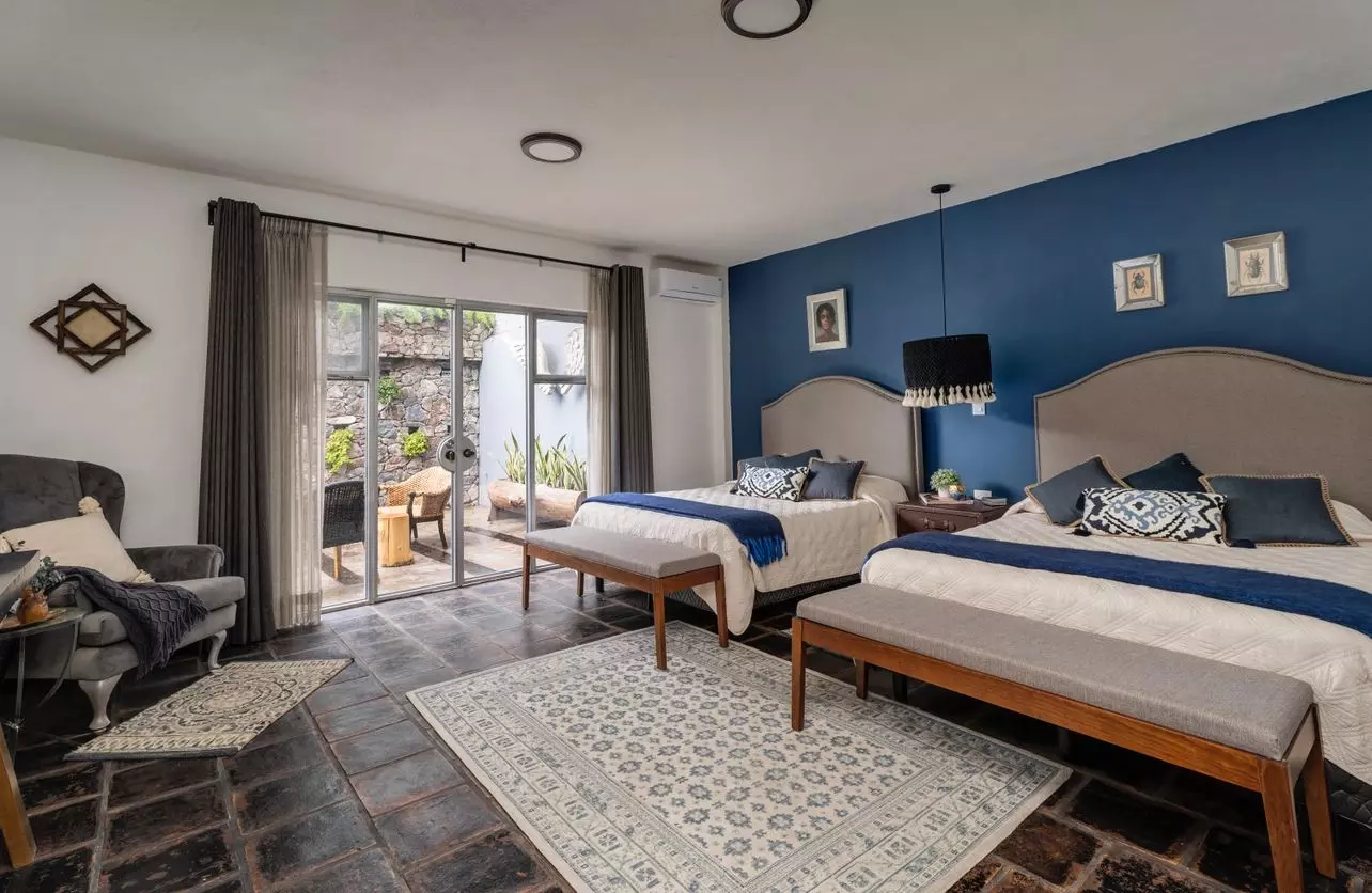 Casa Azul — Balcones, San Miguel de Allende — photo 11 — sophisticated dual-bedroom suite, serene courtyard views