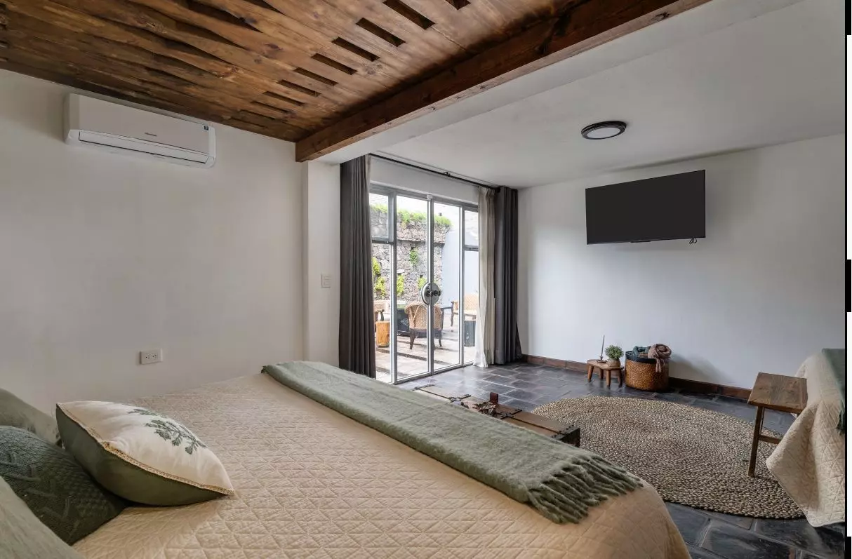 Casa Azul — Balcones, San Miguel de Allende — photo 14 — serene bedroom with courtyard views