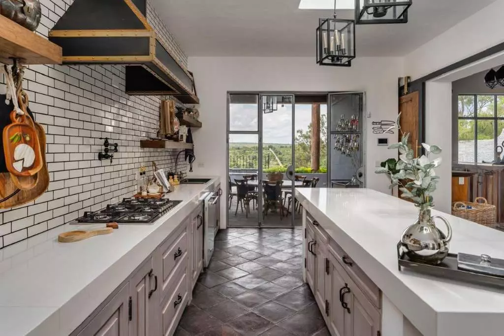 Casa Azul — Balcones, San Miguel de Allende — photo 19 — contemporary kitchen with sweeping countryside views