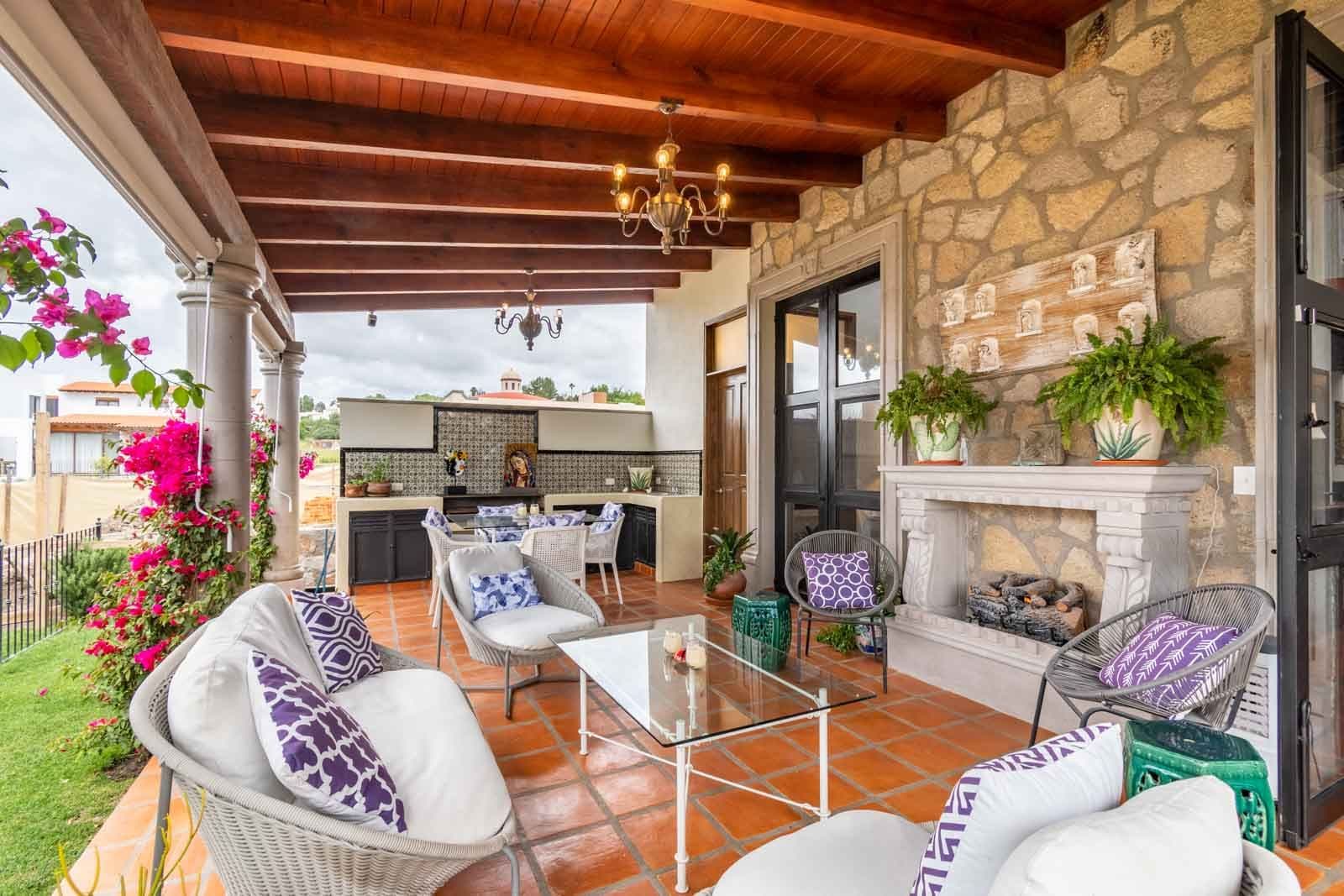 Casa Caterina — Las Campanas, San Miguel de Allende — photo 19 — elegant outdoor living with fireplace charm
