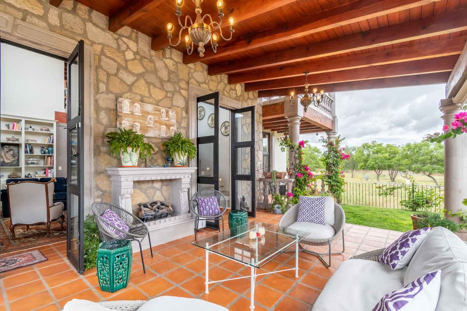 Casa Caterina — Las Campanas, San Miguel de Allende — photo 20 — elegant outdoor living with fireplace views