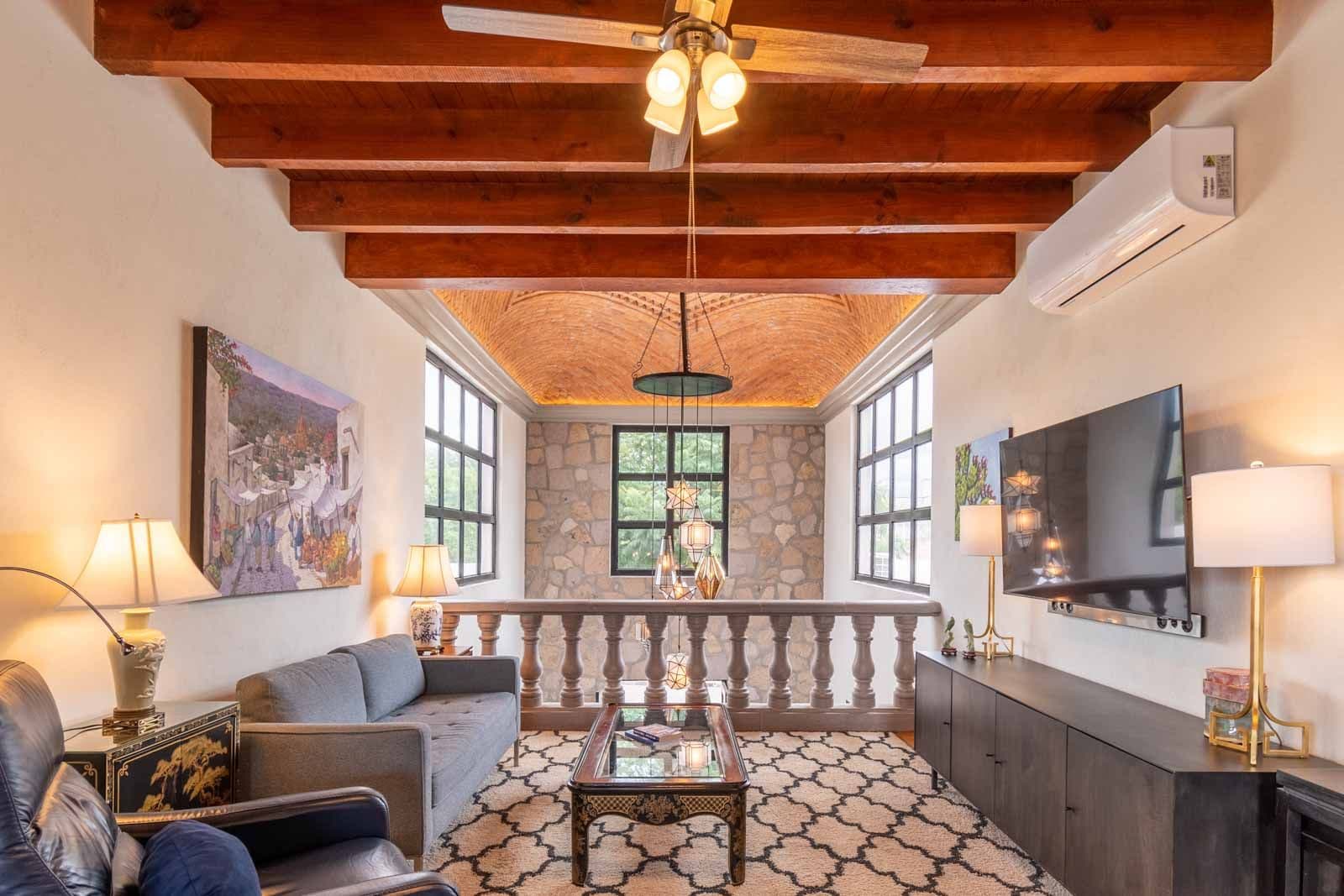 Casa Caterina — Las Campanas, San Miguel de Allende — photo 26 — soaring beams, luminous mezzanine sanctuary