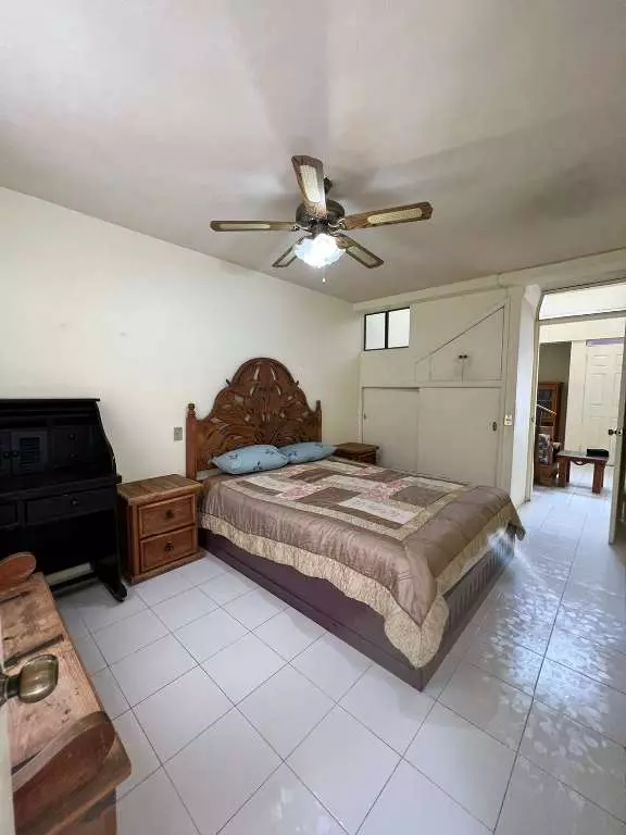 Cielito Lindo — Guadalupe, San Miguel de Allende — photo 3 — spacious bedroom, traditional carved headboard