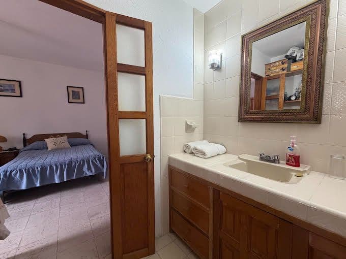 Casa Calzada — Centro, San Miguel de Allende — photo 6 — charming en-suite with warm wood details