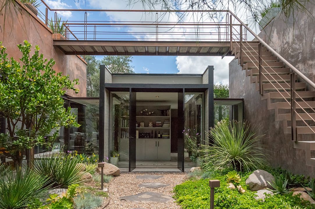 CASA SANCHEZ RENERO — Balcones, San Miguel de Allende — photo 17 — contemporary glass pavilion, verdant courtyard oasis