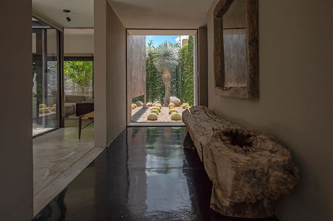 CASA SANCHEZ RENERO — Balcones, San Miguel de Allende — photo 6 — serene corridor with desert courtyard views