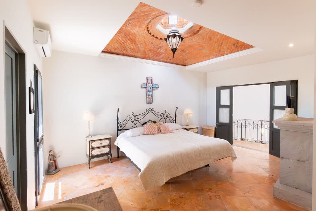 CASA TENERIAS — Centro, San Miguel de Allende — photo 24 — luminous master suite, soaring architectural detail