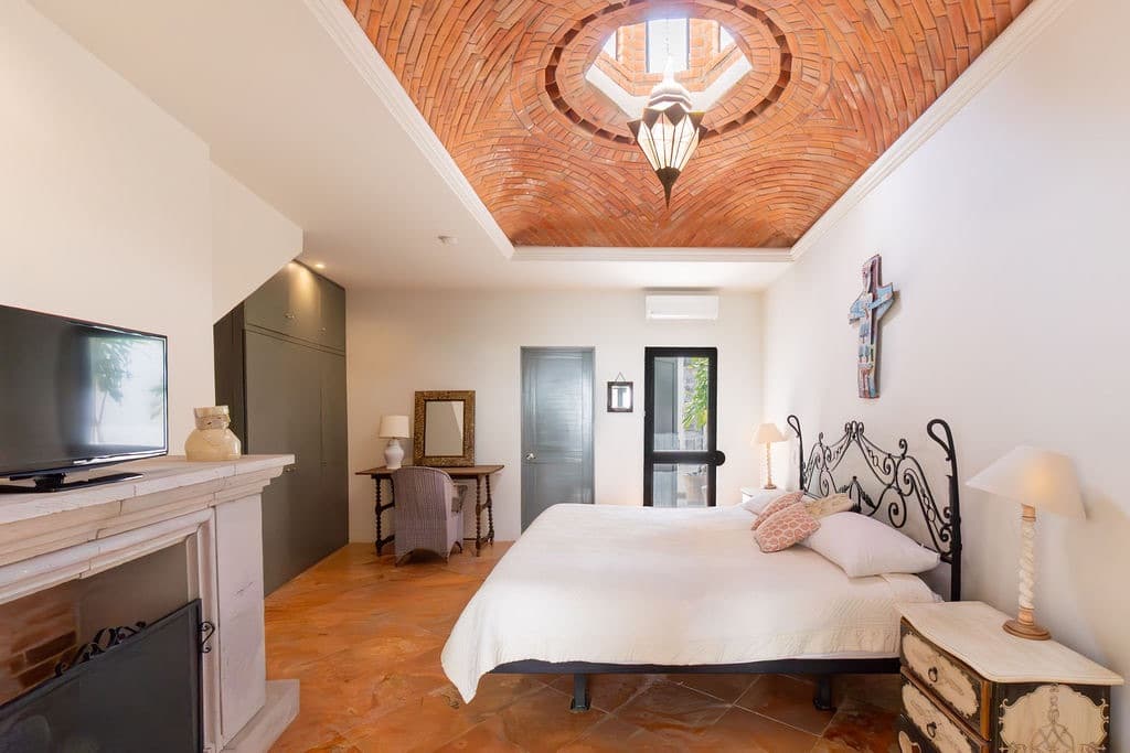 CASA TENERIAS — Centro, San Miguel de Allende — photo 20 — graceful bedroom with soaring wood ceiling