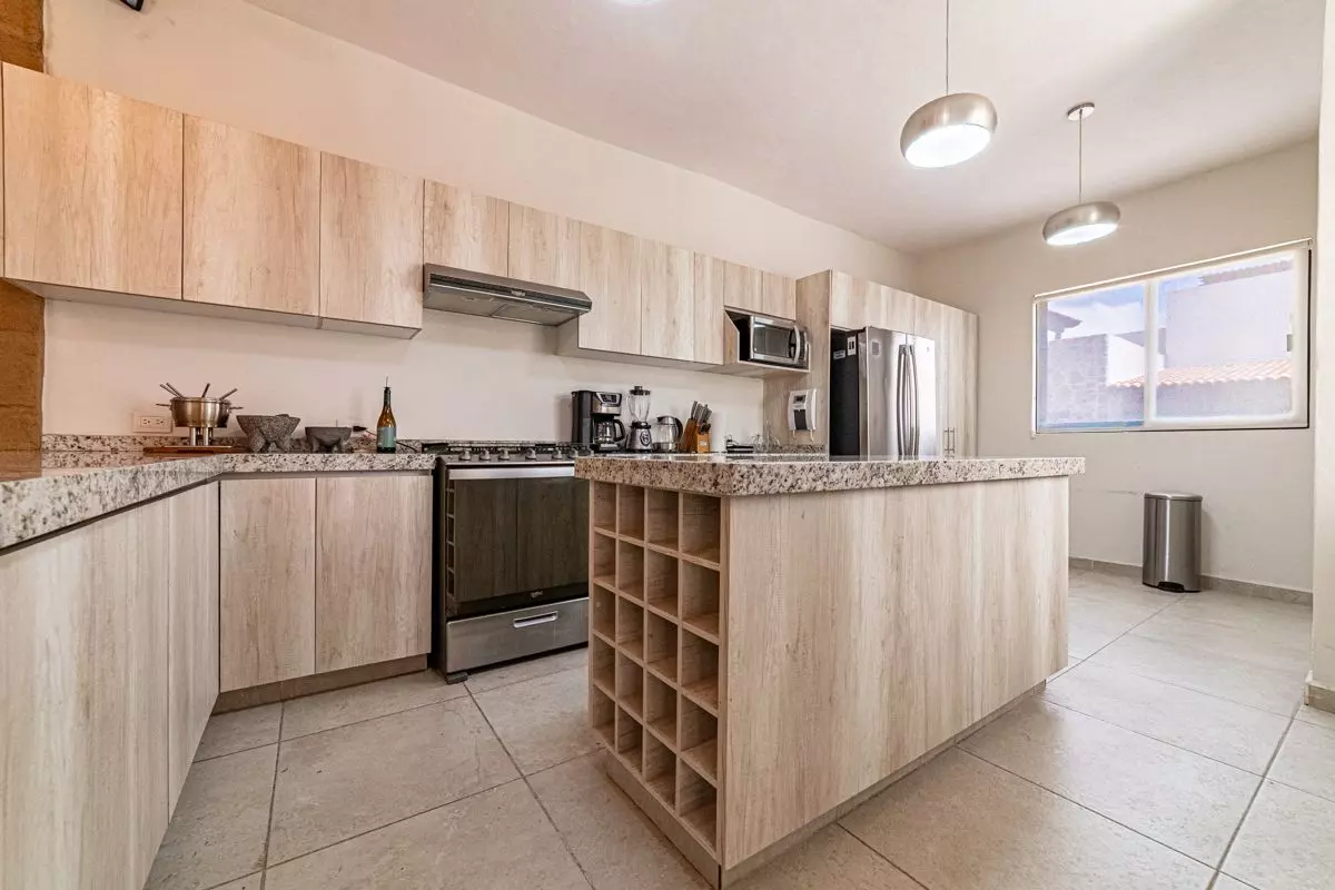 Casa Atardecer — Antigua Residencial, San Miguel de Allende — photo 5 — contemporary chef's kitchen with island elegance