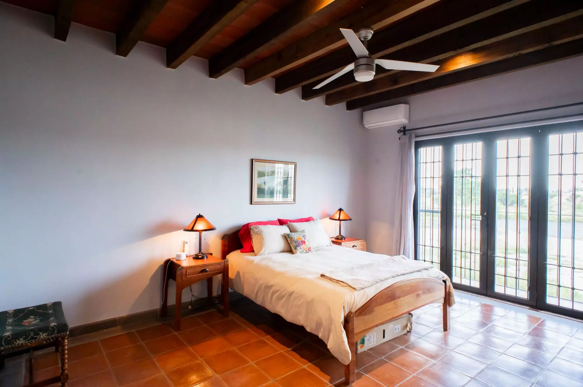 Casa Capricho Azul — El Capricho, San Miguel de Allende — photo 16 — sunlit bedroom with rustic charm