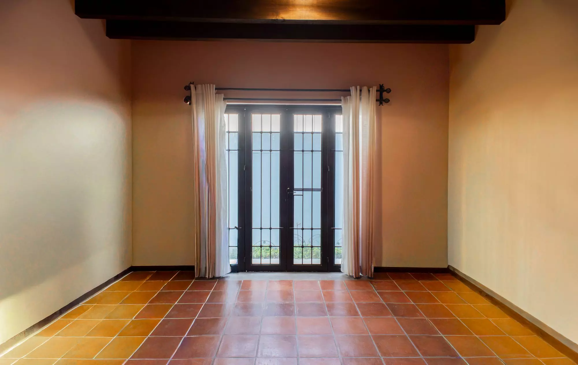 Casa Capricho Azul — El Capricho, San Miguel de Allende — photo 17 — sun-drenched room, authentic terracotta floors
