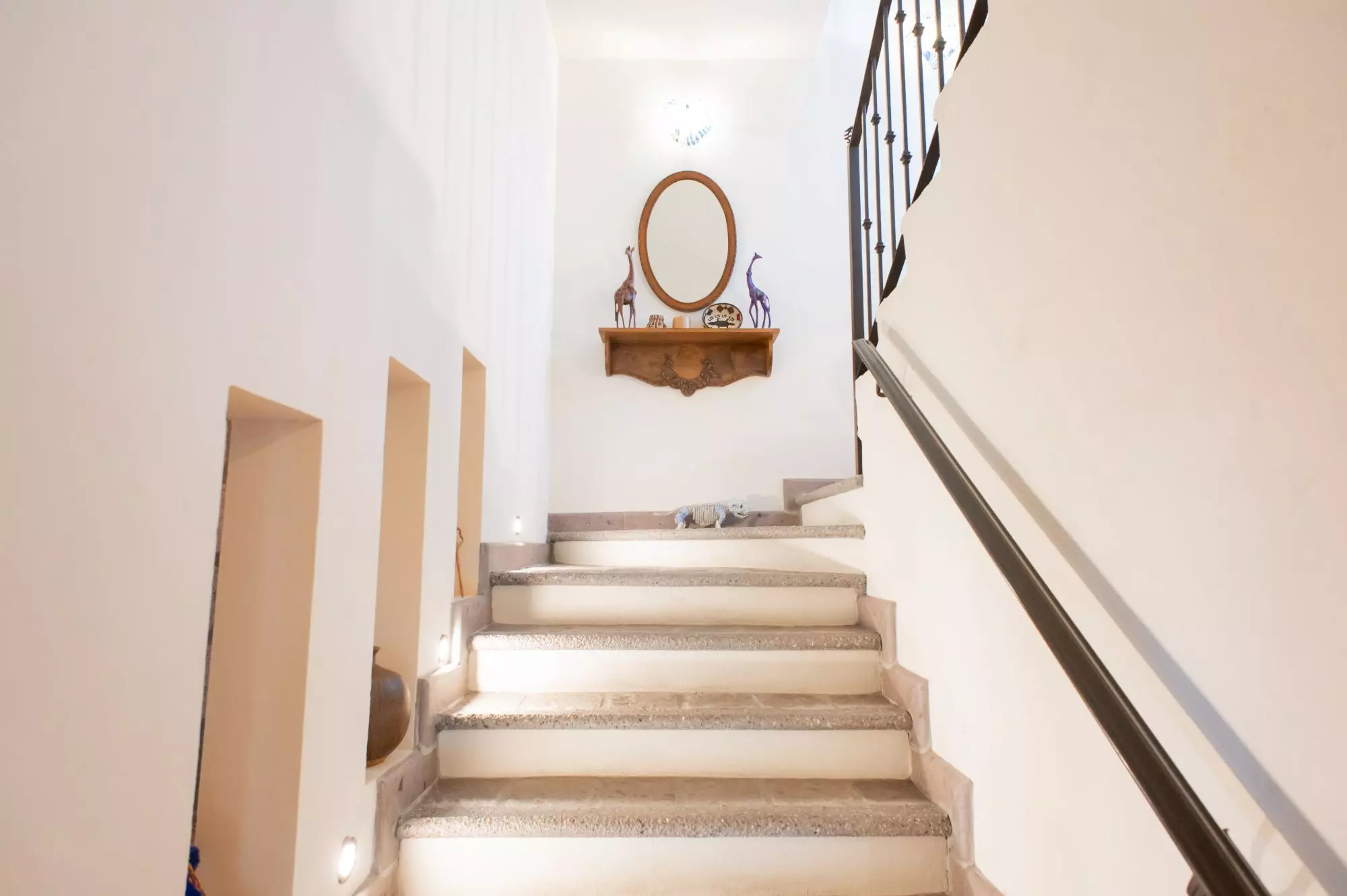 Casa Capricho Azul — El Capricho, San Miguel de Allende — photo 30 — elegant staircase with curated wall décor