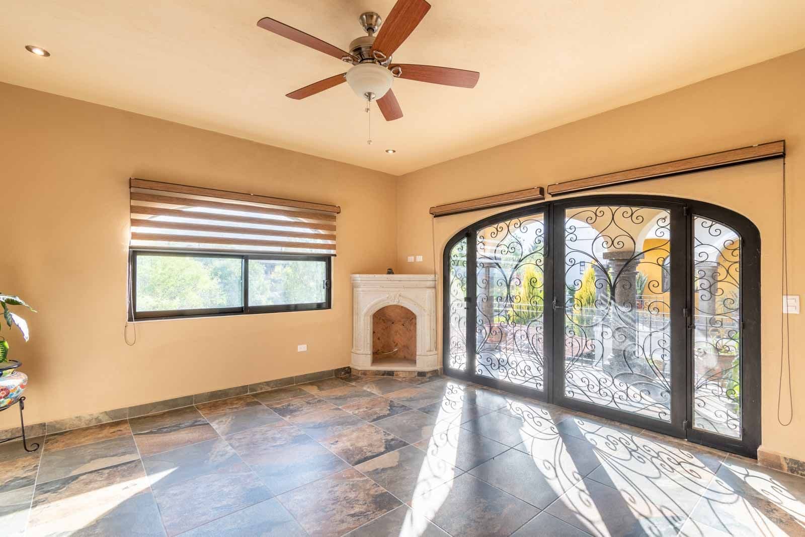 Casa Hacienda del Lago — Los Labradores, San Miguel de Allende — photo 23 — luminous sunroom with ornate garden views