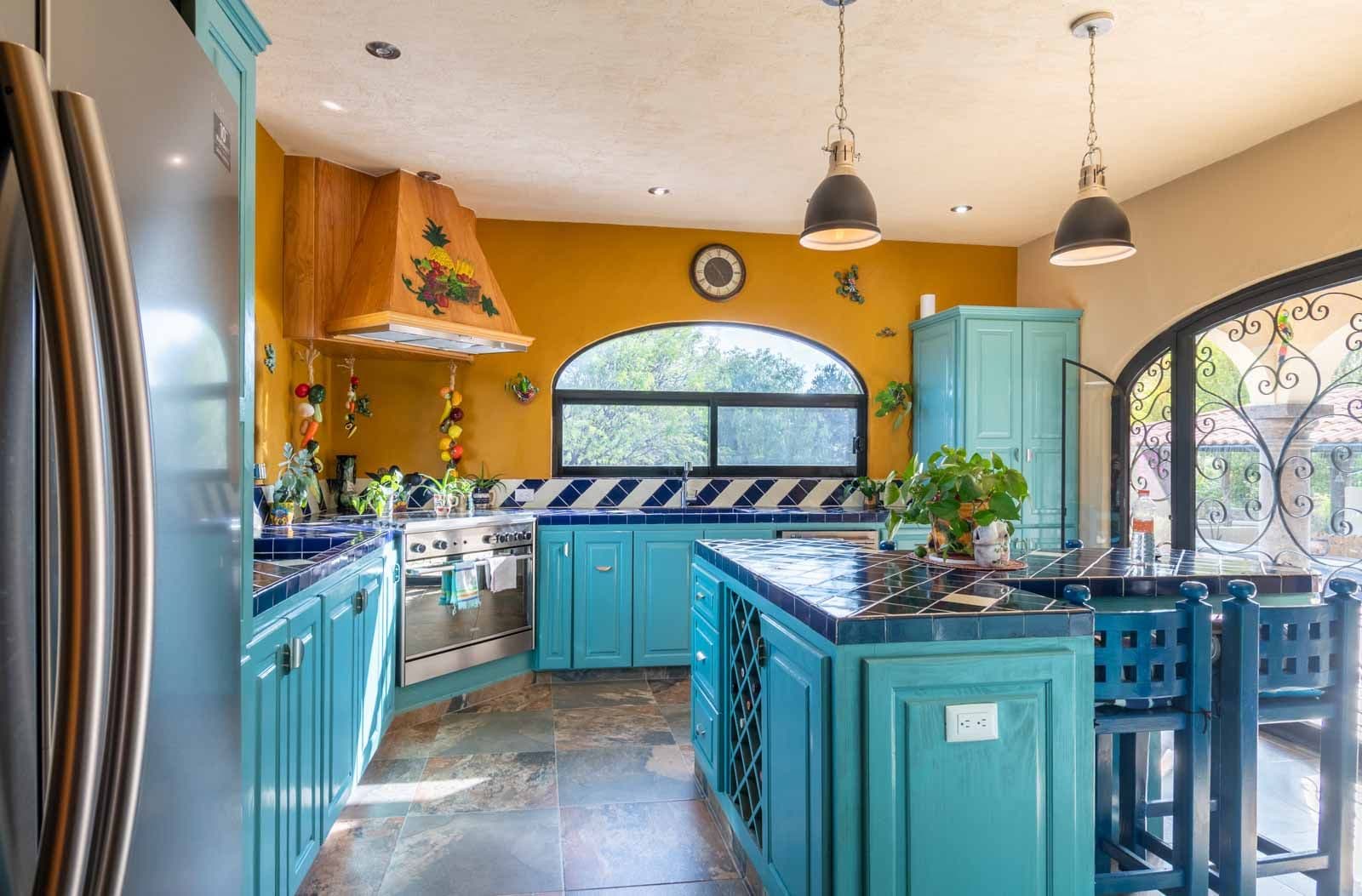 Casa Hacienda del Lago — Los Labradores, San Miguel de Allende — photo 6 — vibrant mediterranean kitchen with graceful arches