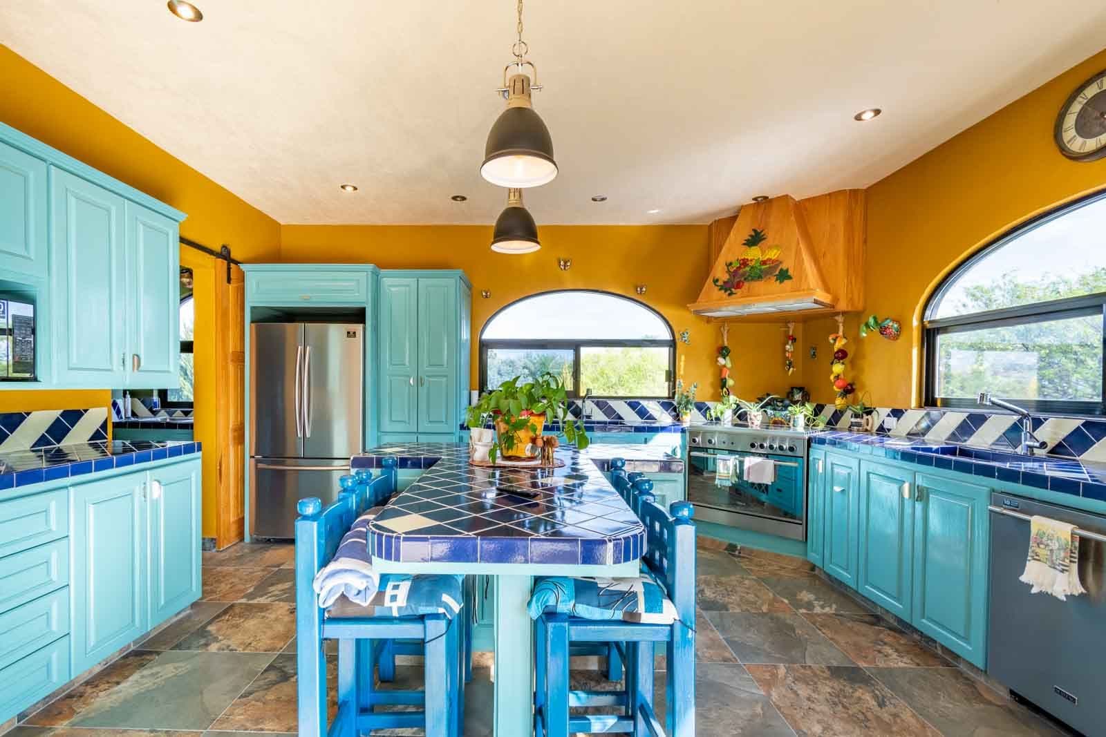 Casa Hacienda del Lago — Los Labradores, San Miguel de Allende — photo 8 — vibrant, artisanal kitchen with poolside views