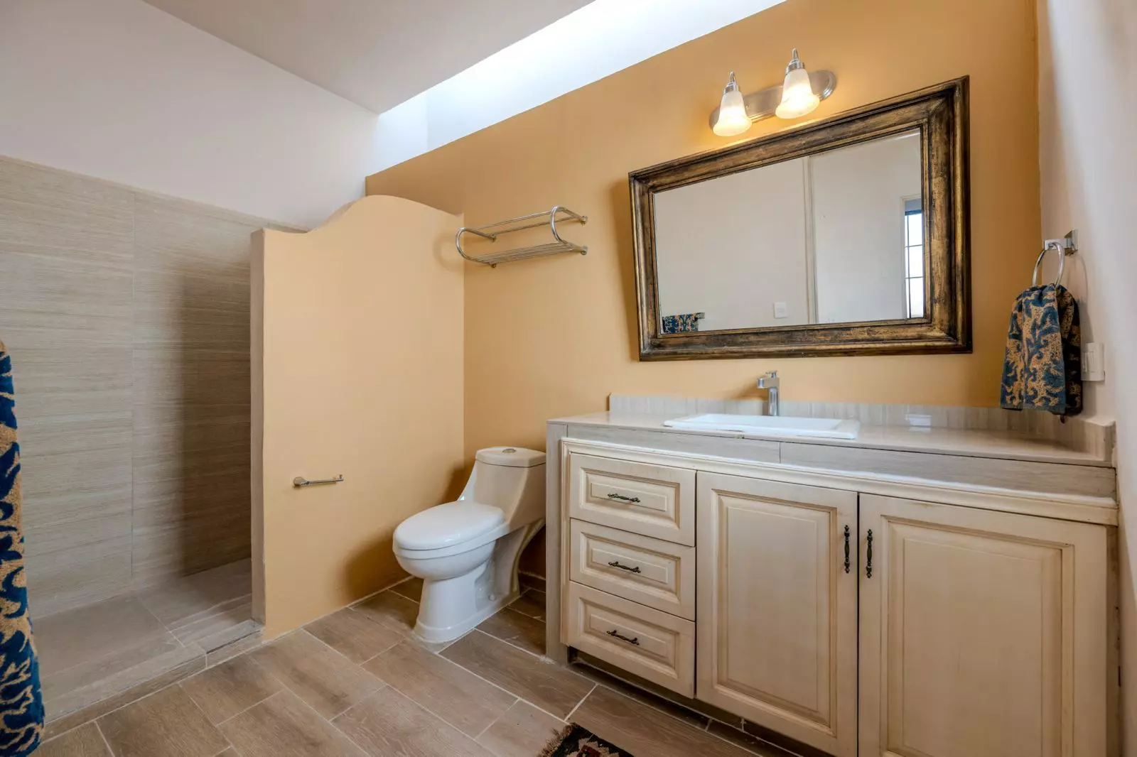 Casa Lenora — Atascadero (Arcos de San Miguel), San Miguel de Allende — photo 5 — spa-inspired bathroom with golden warmth