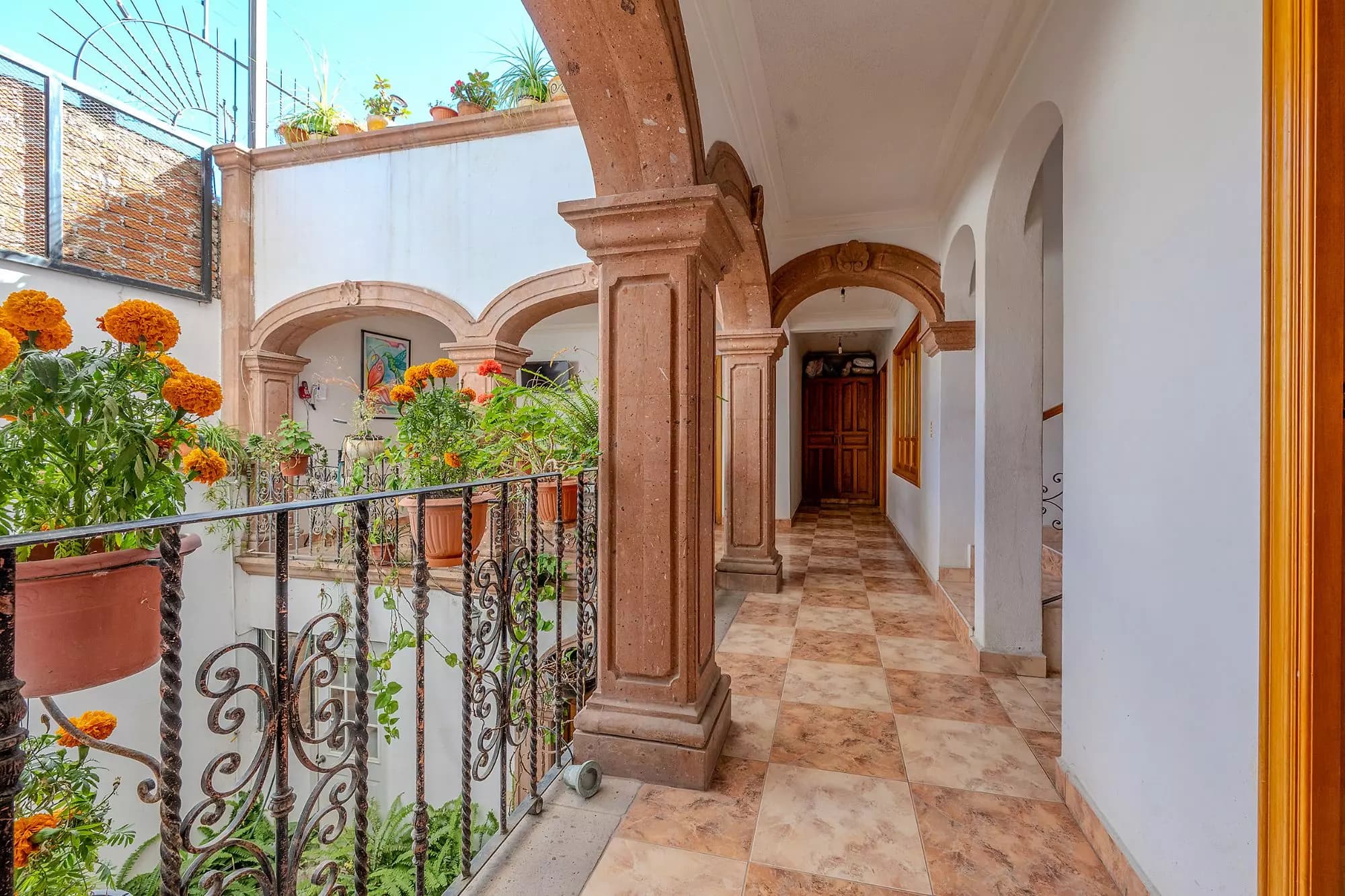Casa Del Refugio — San Antonio, San Miguel de Allende — photo 15 — elegant colonial corridor with terracotta charm