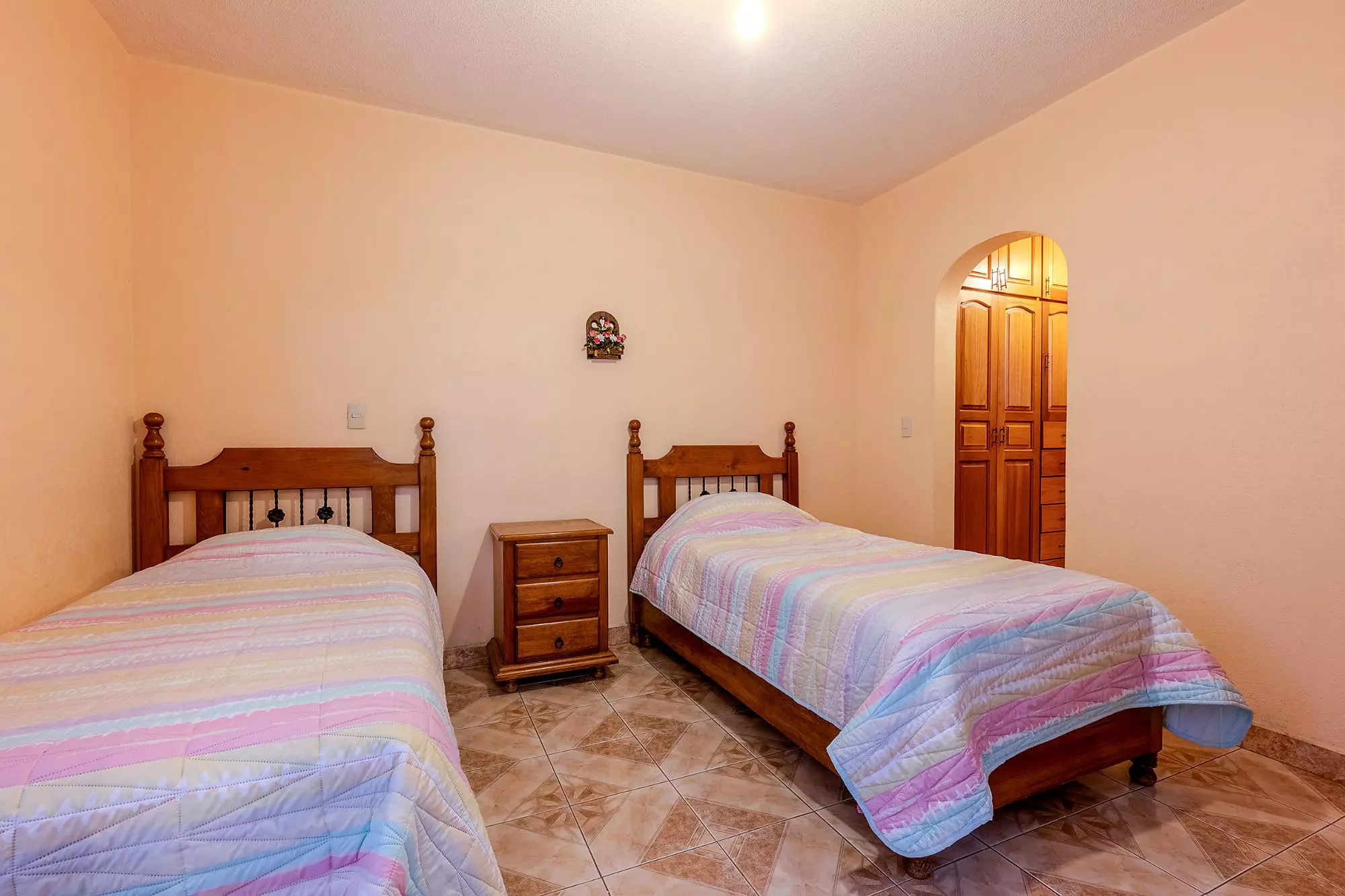 Casa Del Refugio — San Antonio, San Miguel de Allende — photo 12 — sun-drenched guest bedroom, authentic wooden furnishings